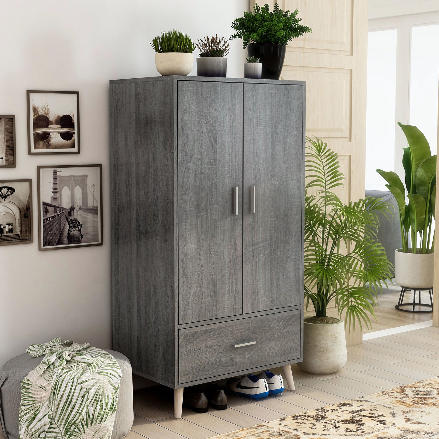 Right angled mid-century modern distressed gray two-door one-drawer wardrobe armoire in a bedroom with accessories