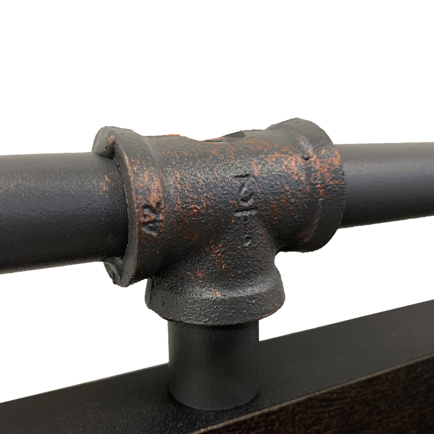 Right angled close-up water pipe joint detail from an industrial reclaimed black oak and water pipe wall mirror on a white background