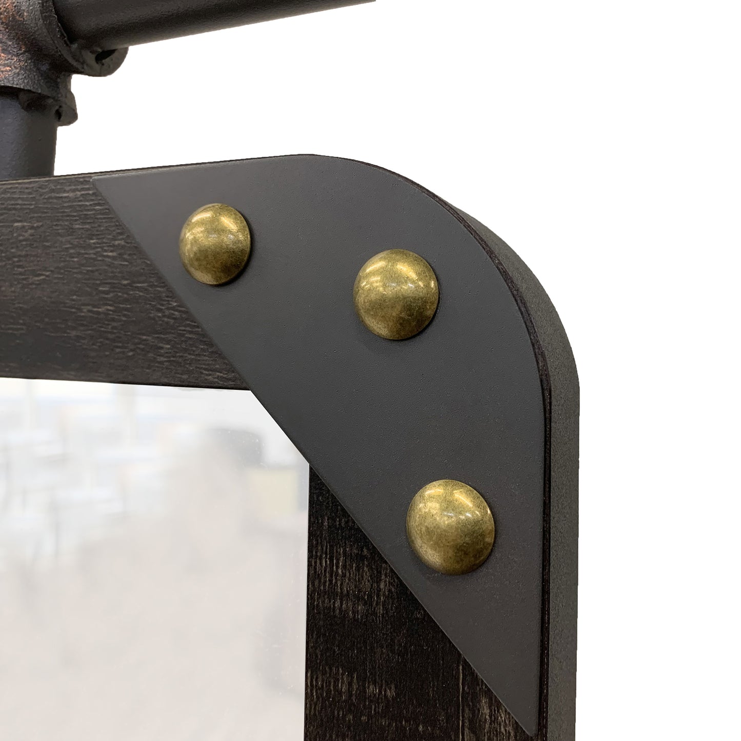 Left angled close-up corner bracket detail from an industrial reclaimed black oak and water pipe wall mirror on a white background
