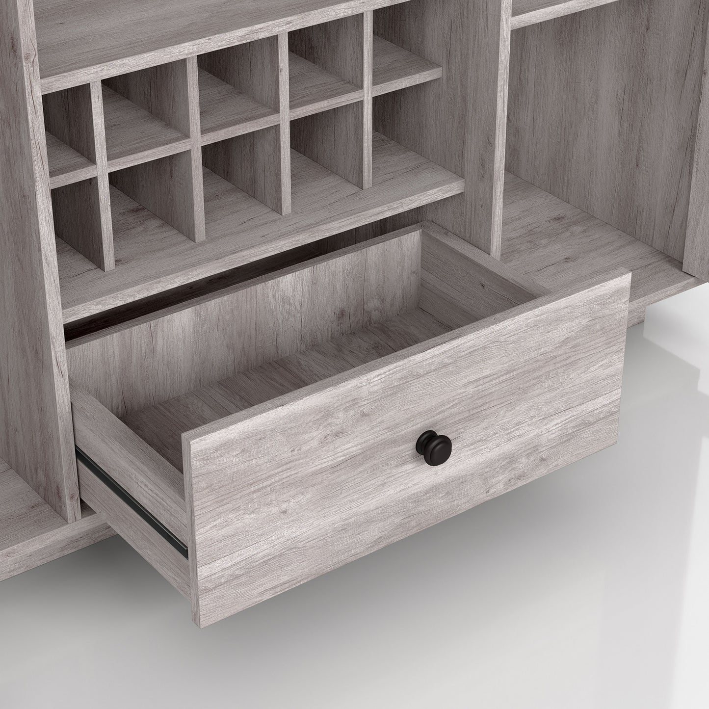 Right angled close-up view of a transitional coastal white six-shelf 10-bottle wine cabinet with glass doors and drawer open on a white background