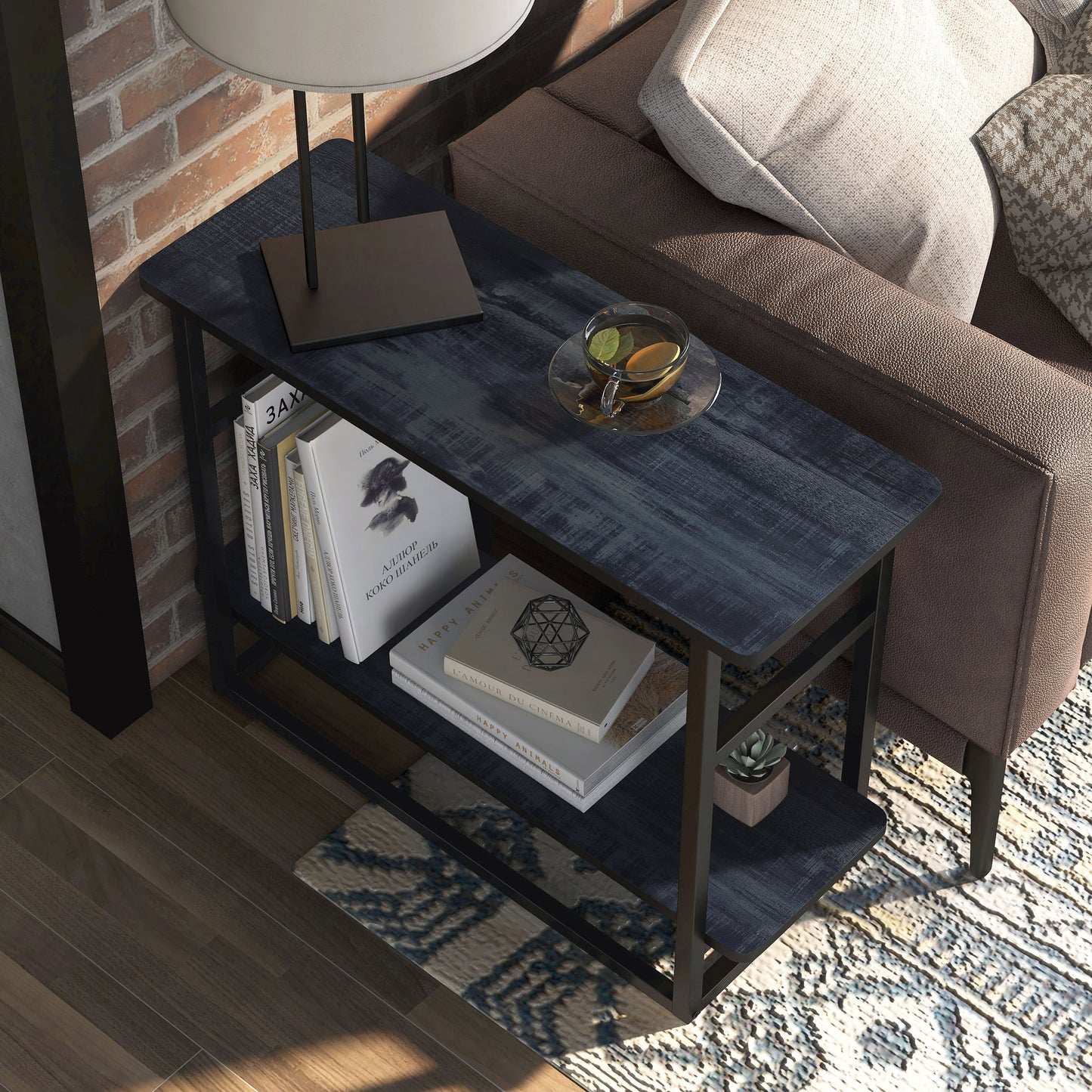 Right angled close-up bird's eye view of an industrial rustic navy blue one-shelf long side table in a living room with accessories