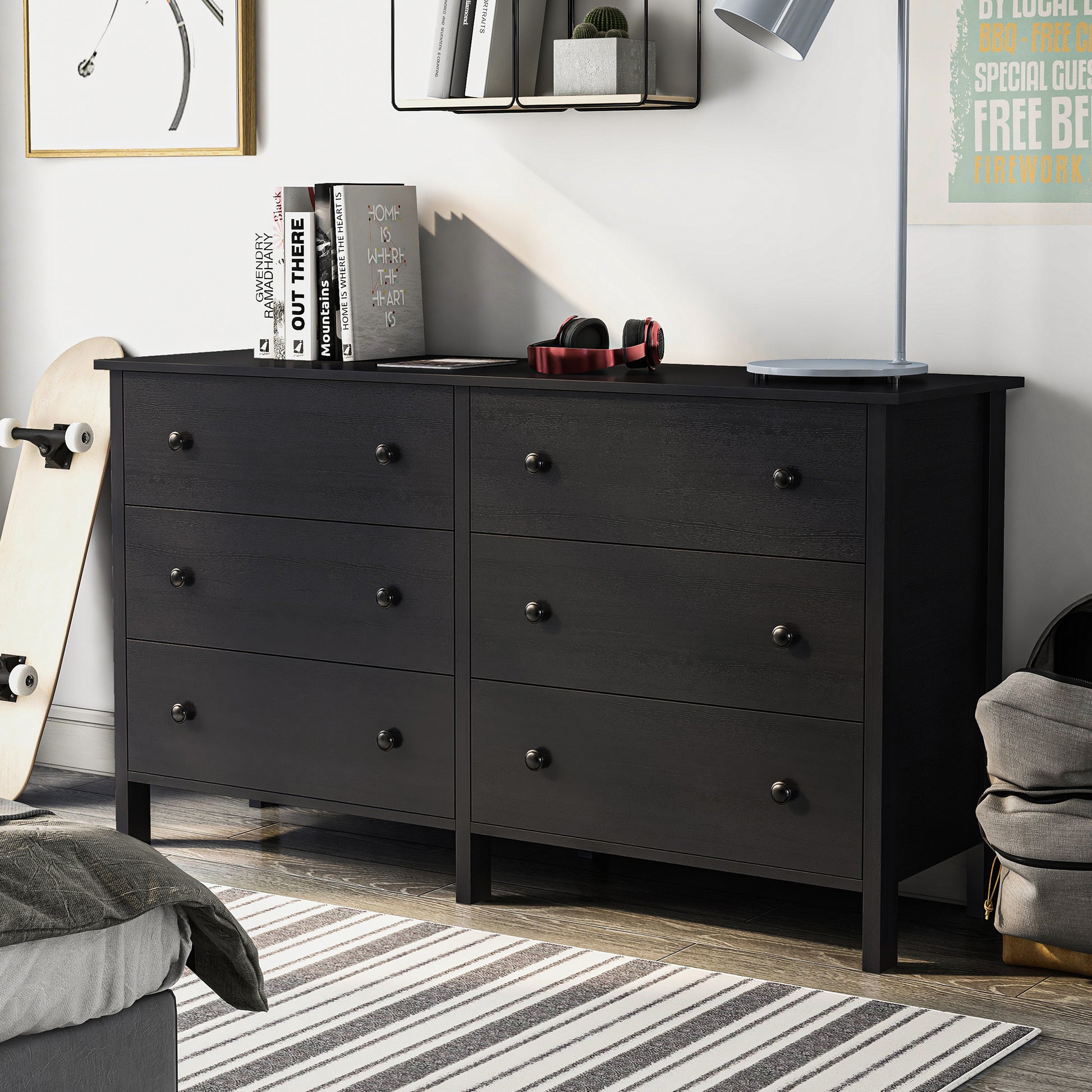 Left angled transitional black six-drawer youth dresser in a bedroom with accessories