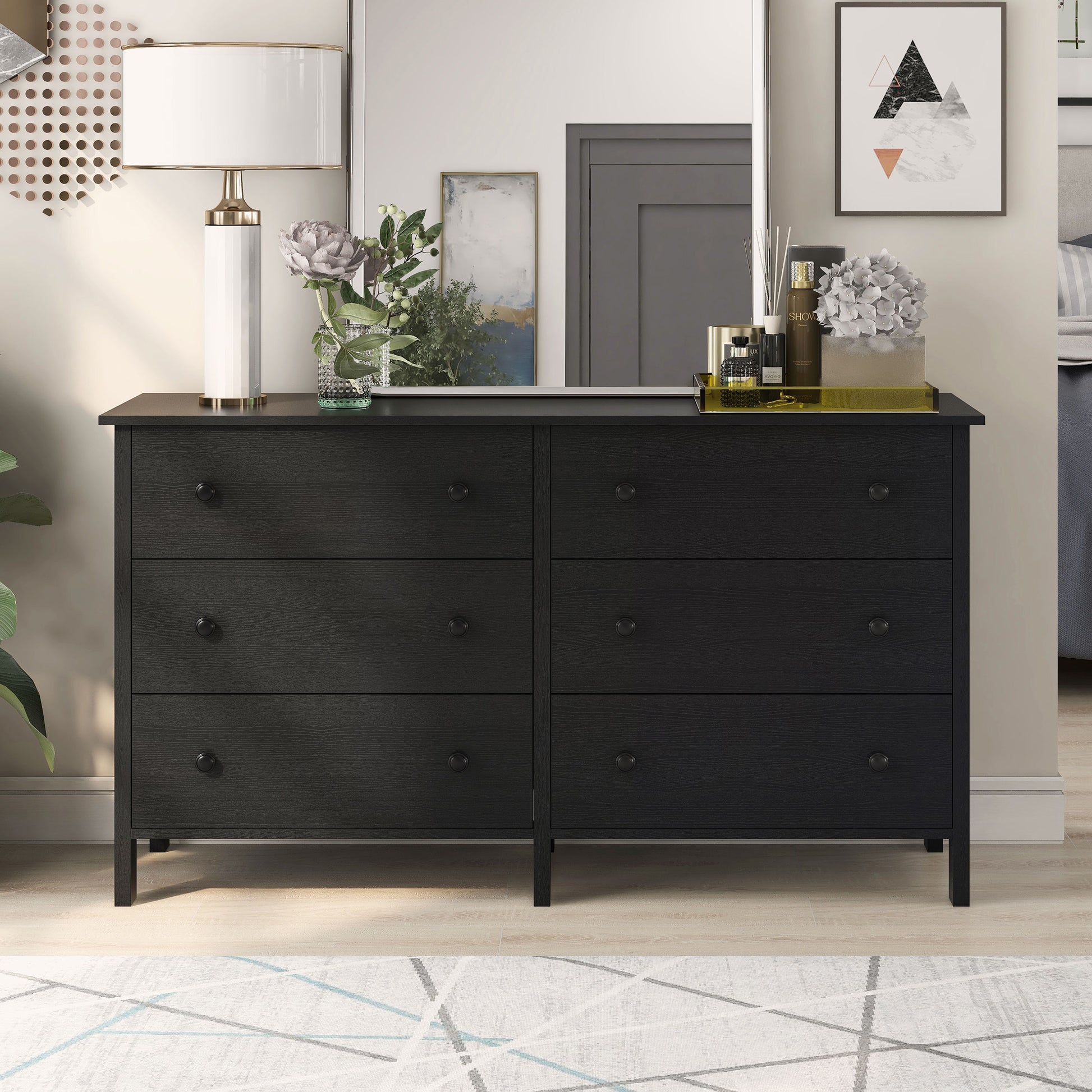 Front-facing transitional black six-drawer youth dresser in a bedroom with accessories