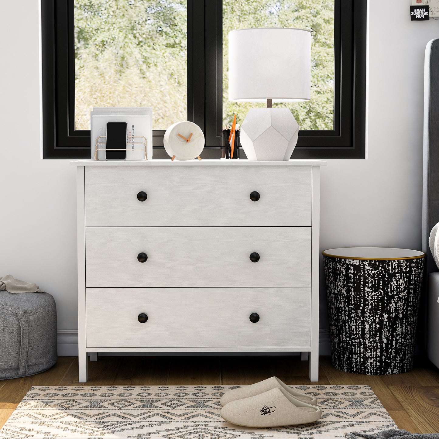 Front-facing transitional white three-drawer youth dresser in a bedroom with accessories