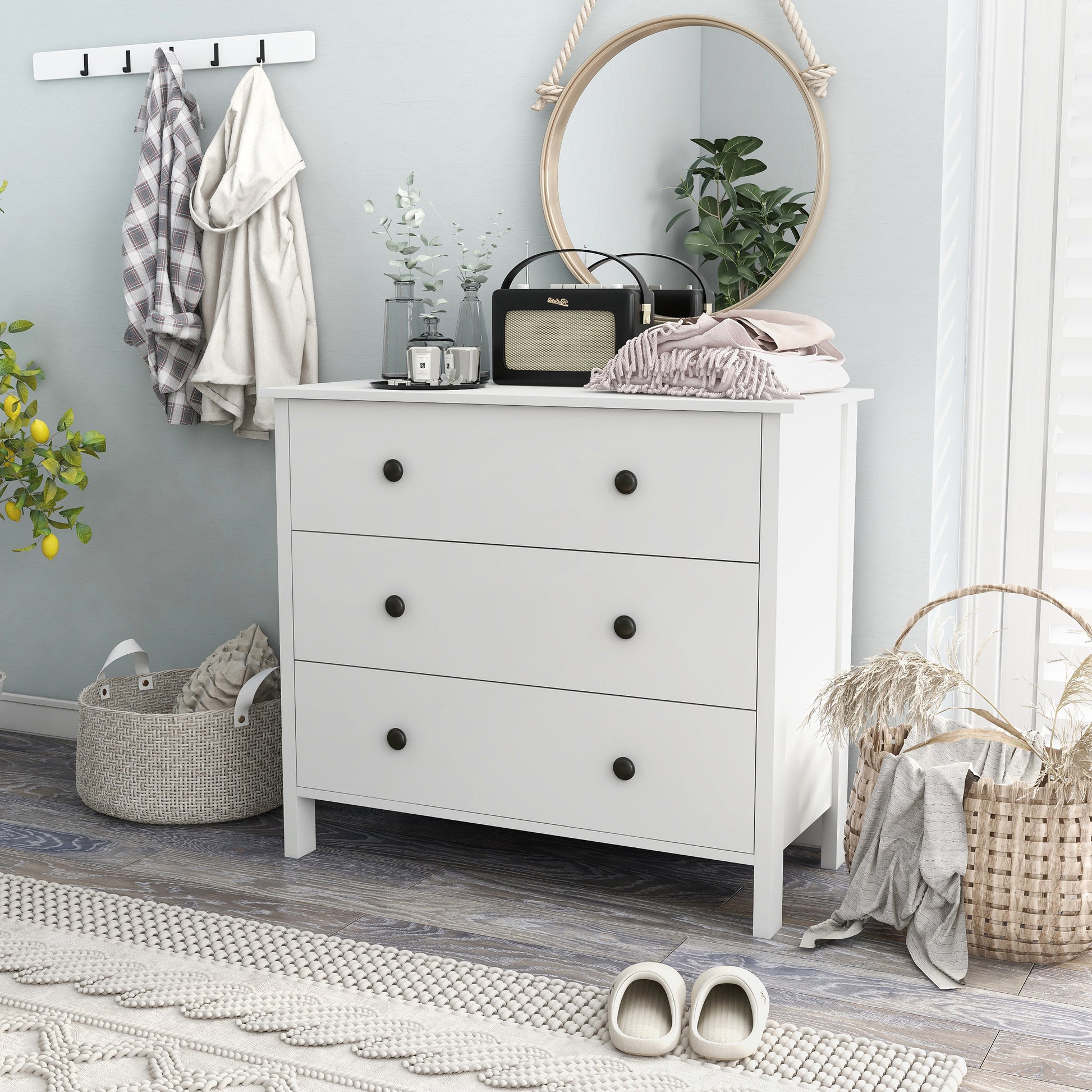 Left angled transitional white three-drawer youth dresser in a bedroom with accessories