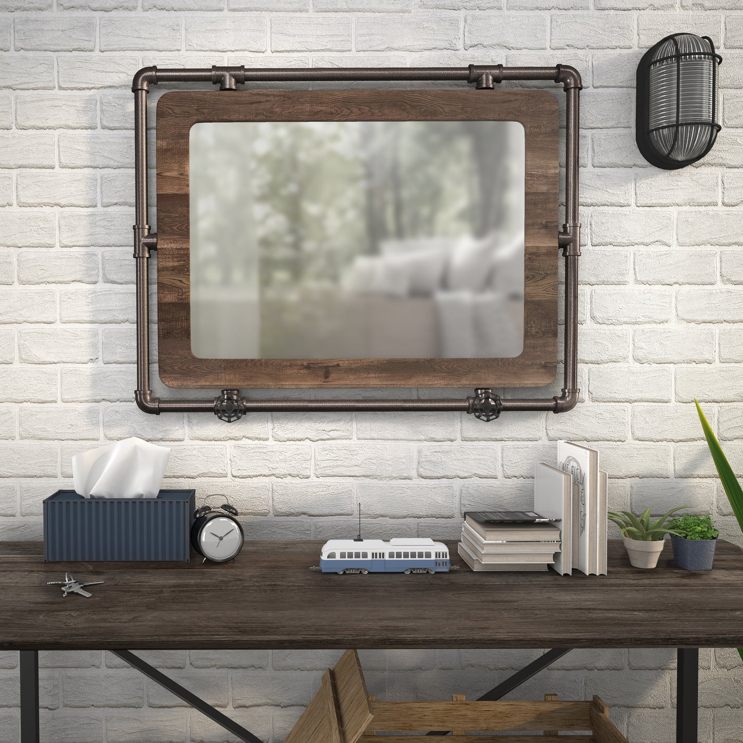 Front-facing industrial reclaimed oak and water pipe wall mirror over a table with accessories