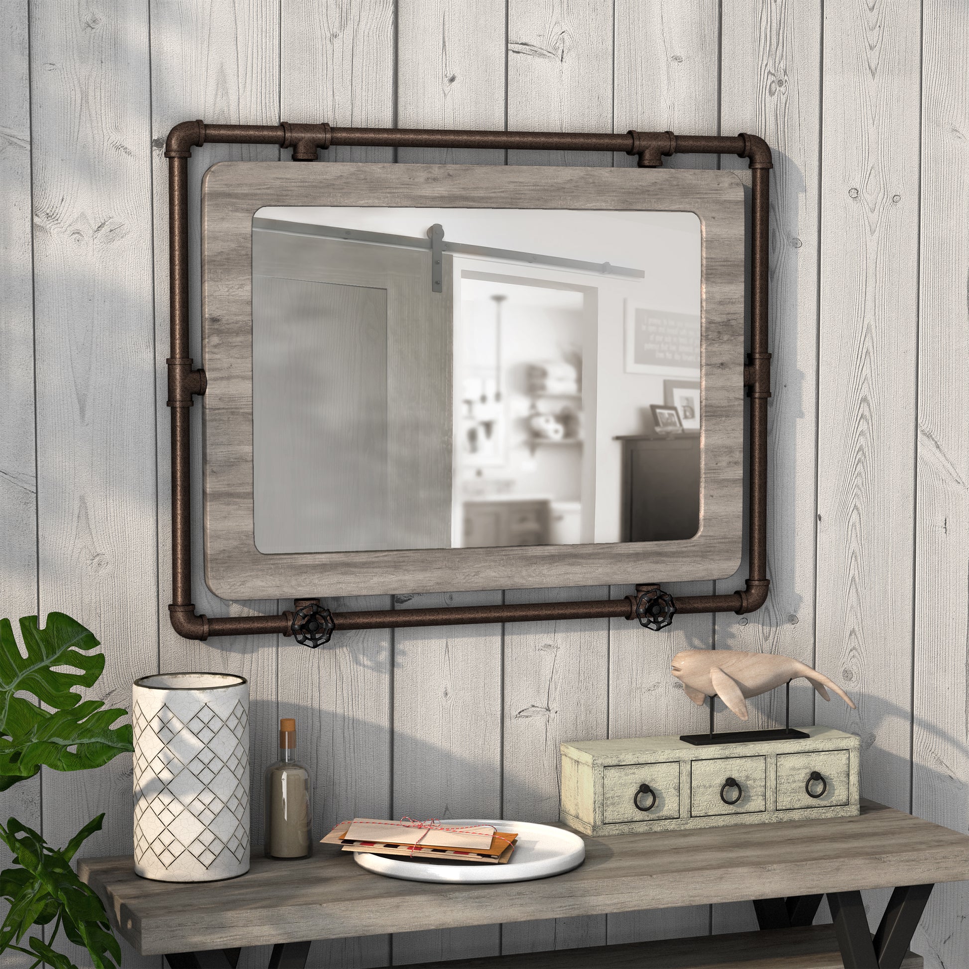 Right angled industrial vintage gray oak and water pipe wall mirror over a table with accessories