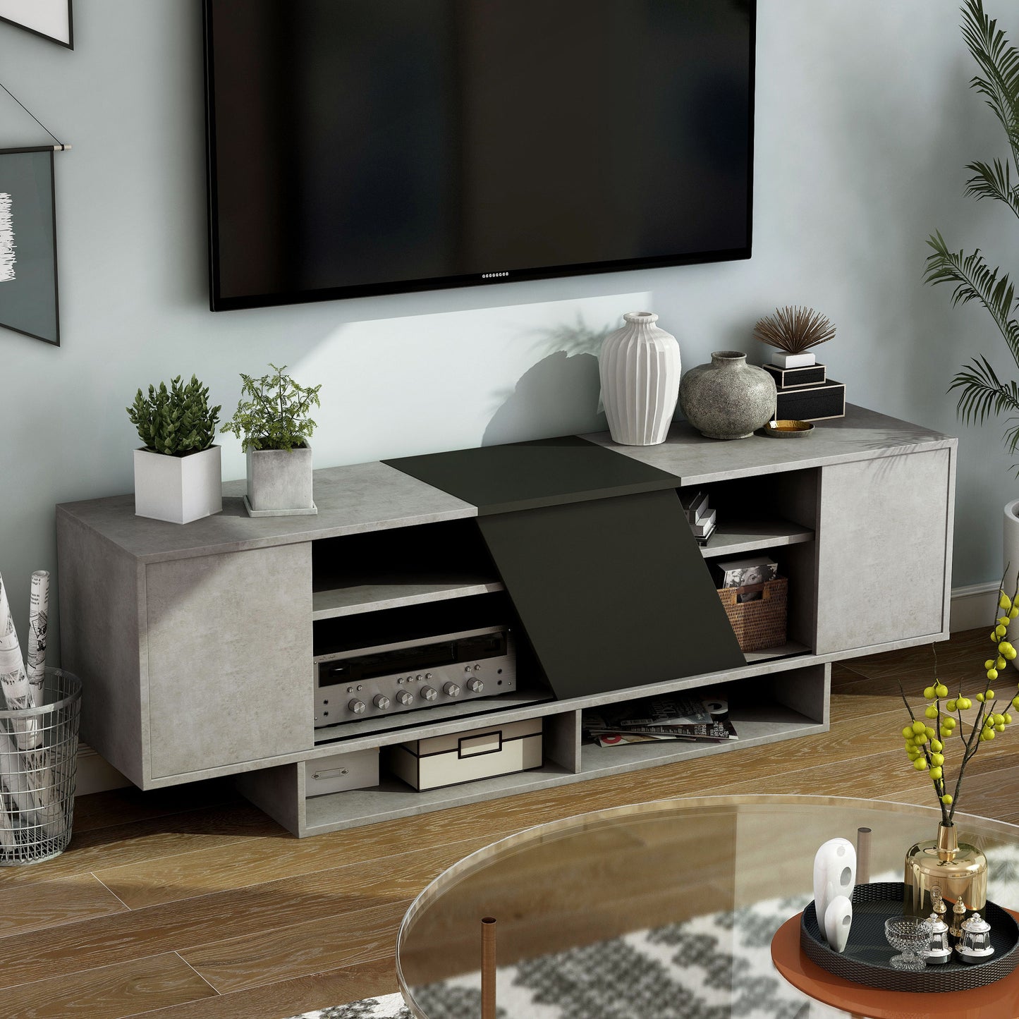 Right angled modern cement gray and black six-shelf TV stand in a living room with accessories