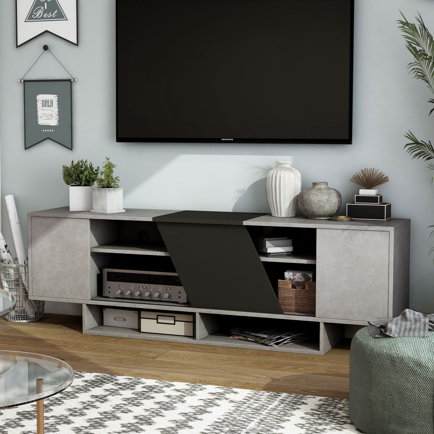 Left angled modern cement gray and black six-shelf TV stand in a living room with accessories