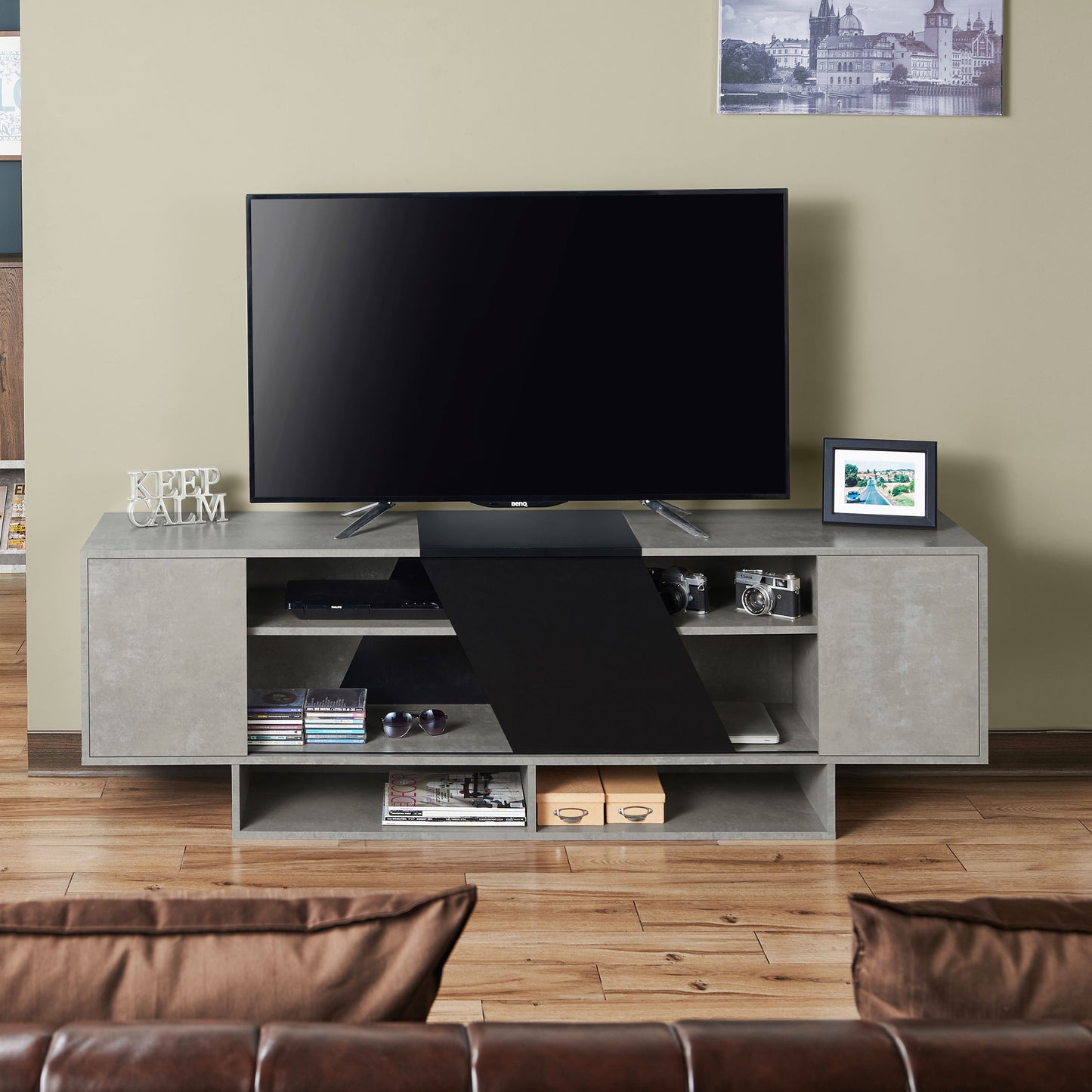 Front-facing modern cement gray and black six-shelf TV stand in a living room with accessories