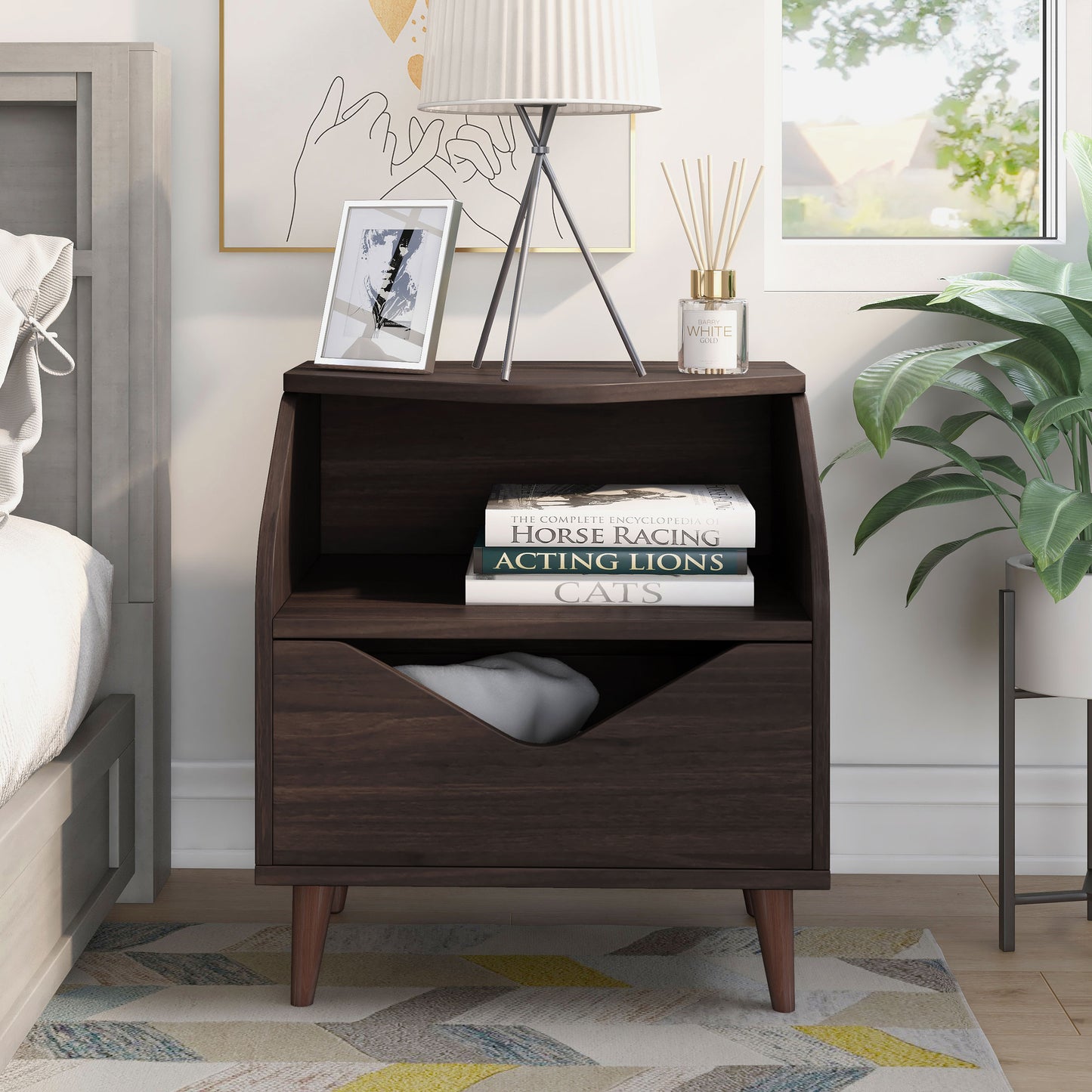 Front-facing mid-century modern wenge one-drawer end table in a bedroom with accessories