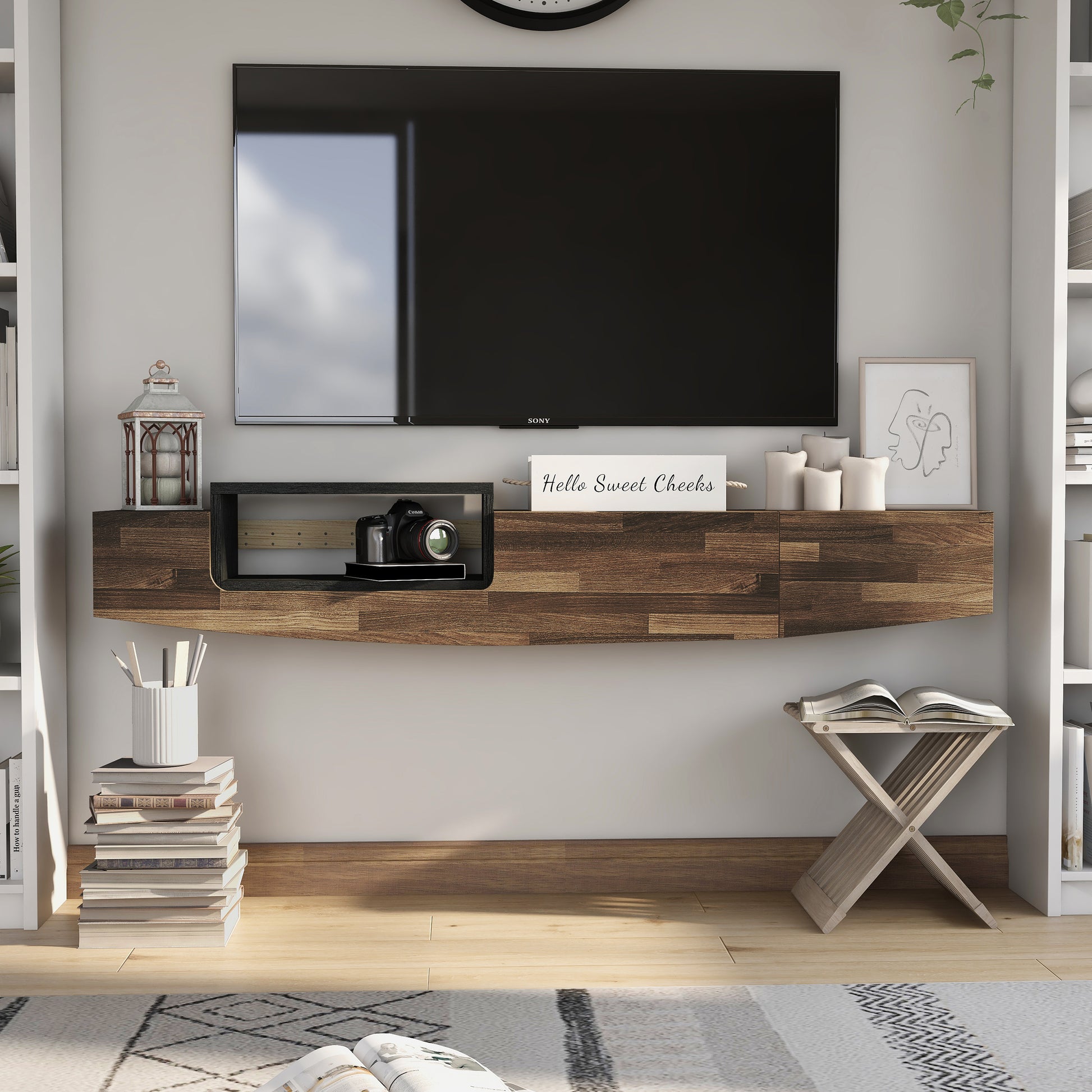 Front-facing farmhouse light hickory and black one-drawer lift-top floating TV console in a living room with accessories