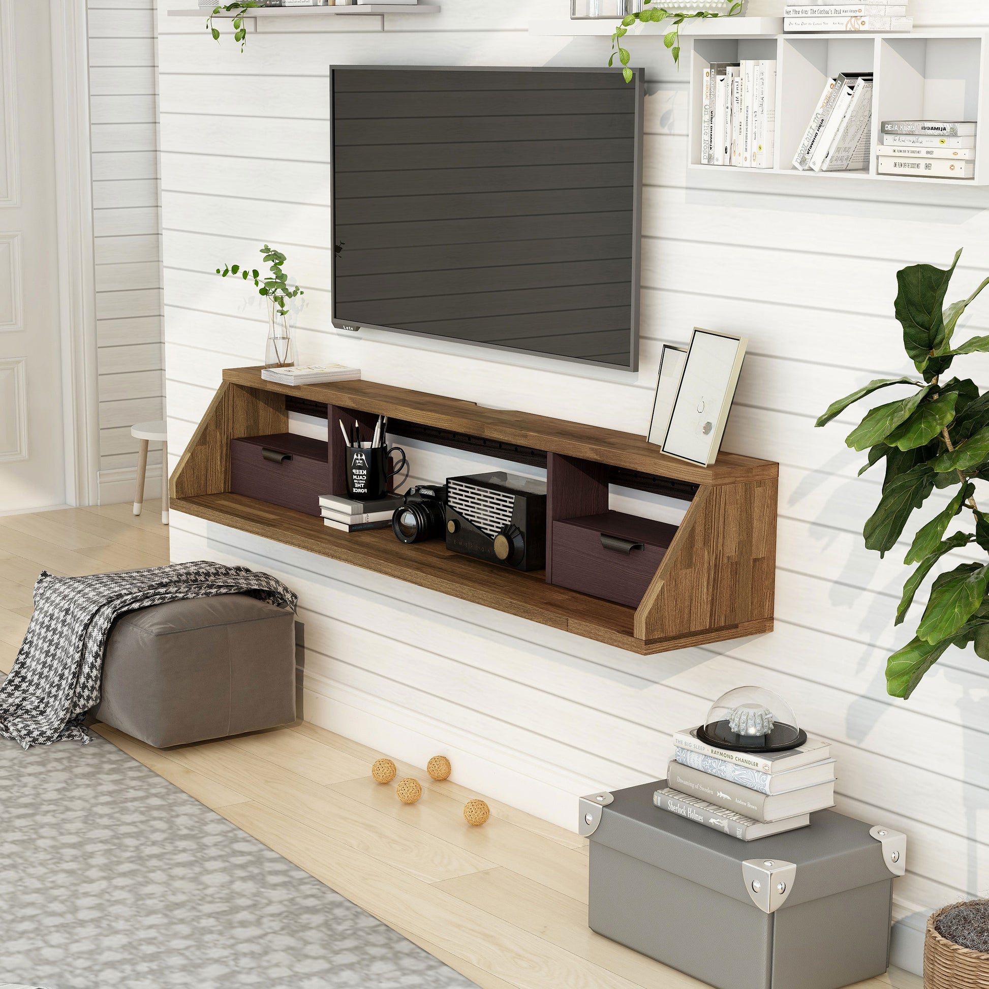 Left angled modern light hickory and wine multi-shelf floating TV console in a living room with accessories