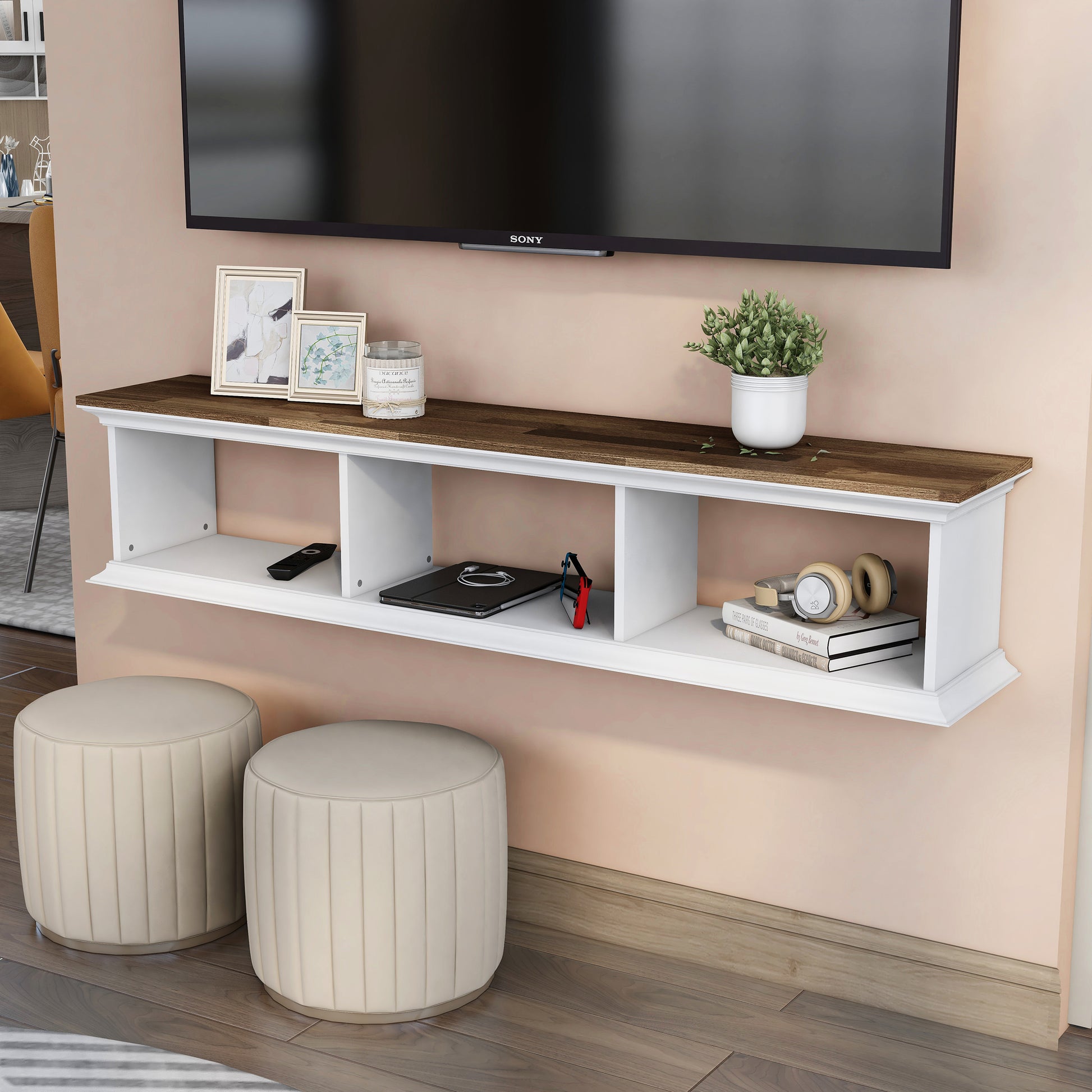 Left angled transitional light hickory and white floating TV stand with three shelves in a living room with accessories