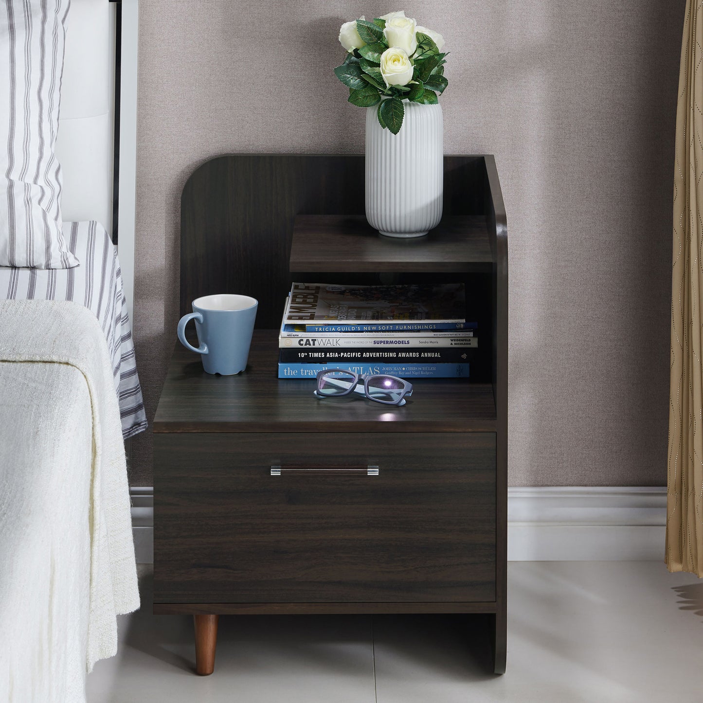 Front-facing contemporary wenge one-drawer nightstand with a mini shelf in a bedroom with accessories