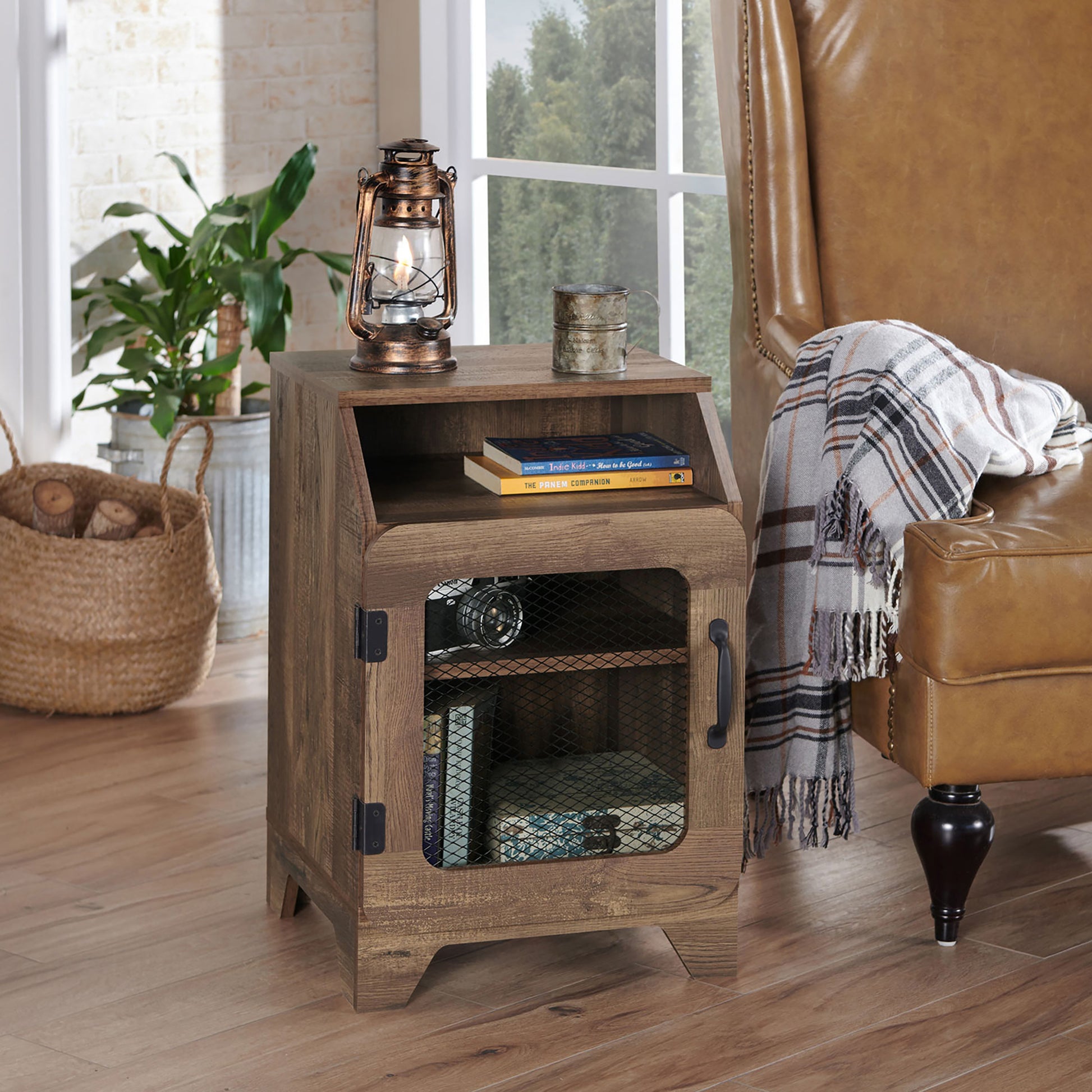 Right angled rustic reclaimed oak three-shelf end table with a metal mesh door in a living room with accessories