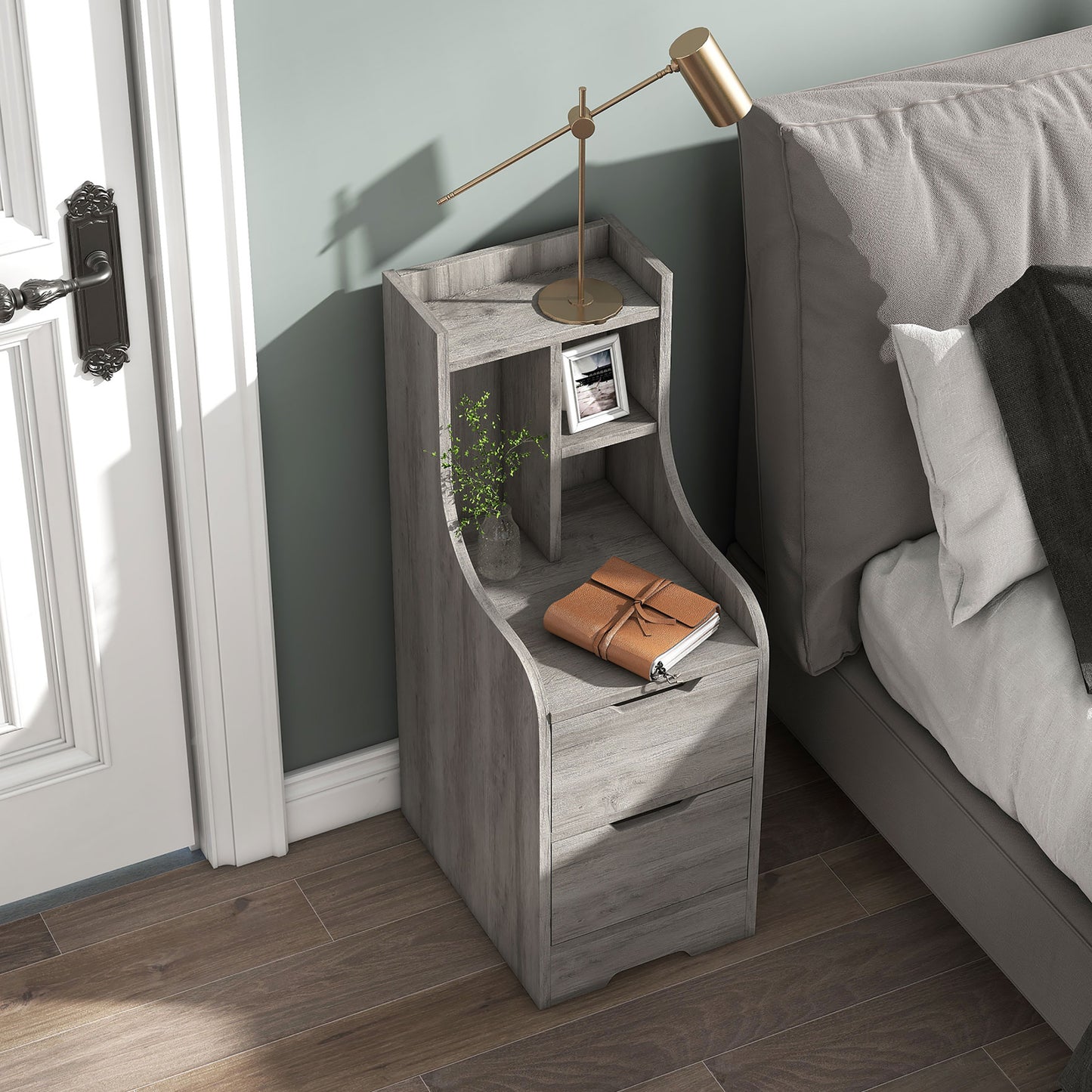Right angled bird's eye view of a modern vintage gray oak two-drawer nightstand with shelves in a bedroom with accessories