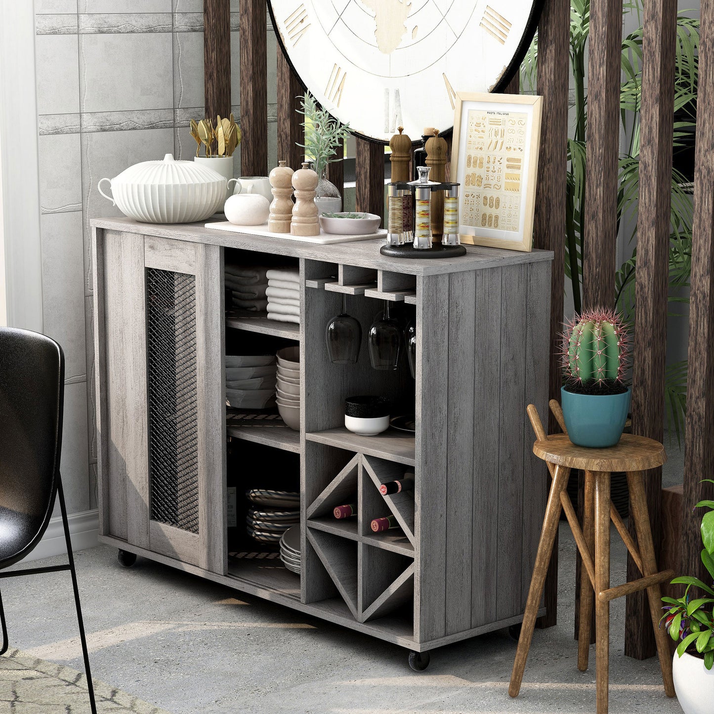 Left angled rustic vintage gray oak mobile two-sliding door bar cart with stemware and bottle storage and one door open in a living area with accessories