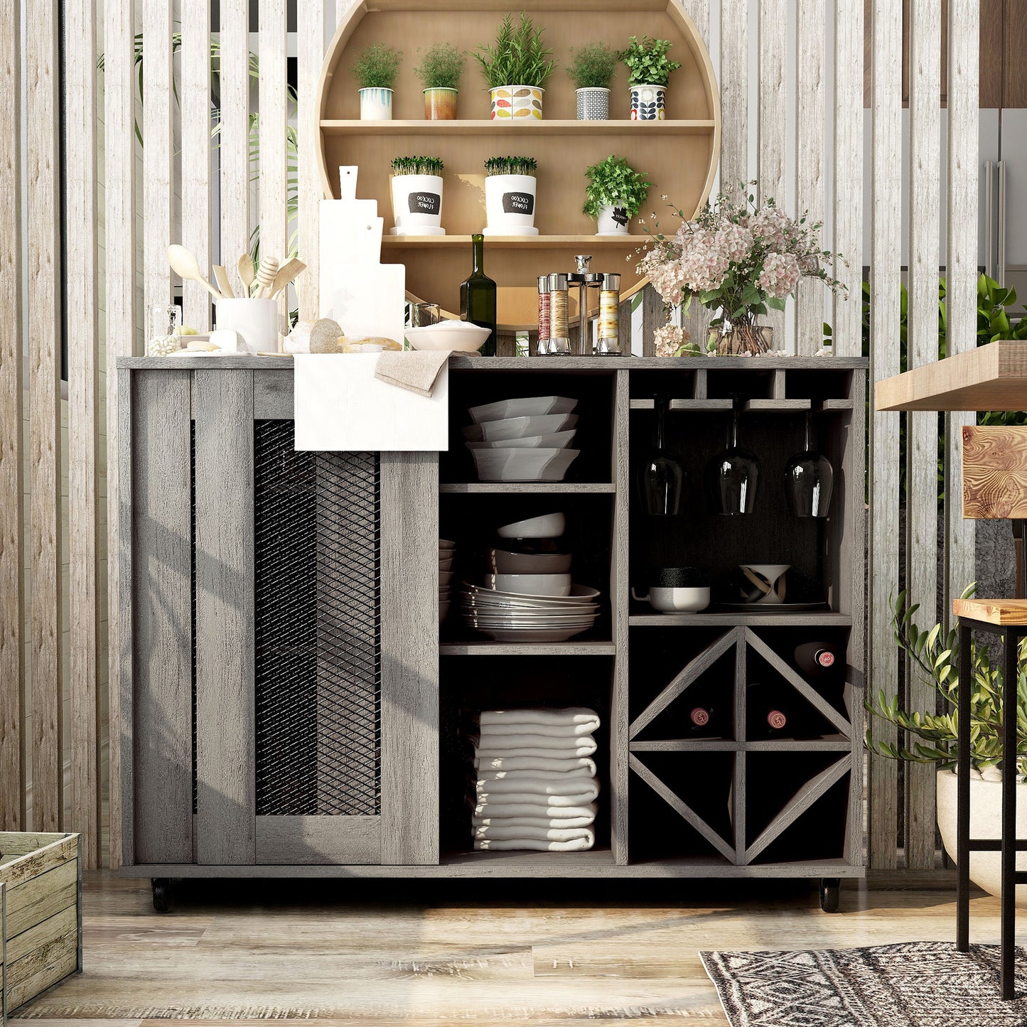 Front-facing rustic vintage gray oak mobile two-sliding door bar cart with stemware and bottle storage and one door open in a living area with accessories
