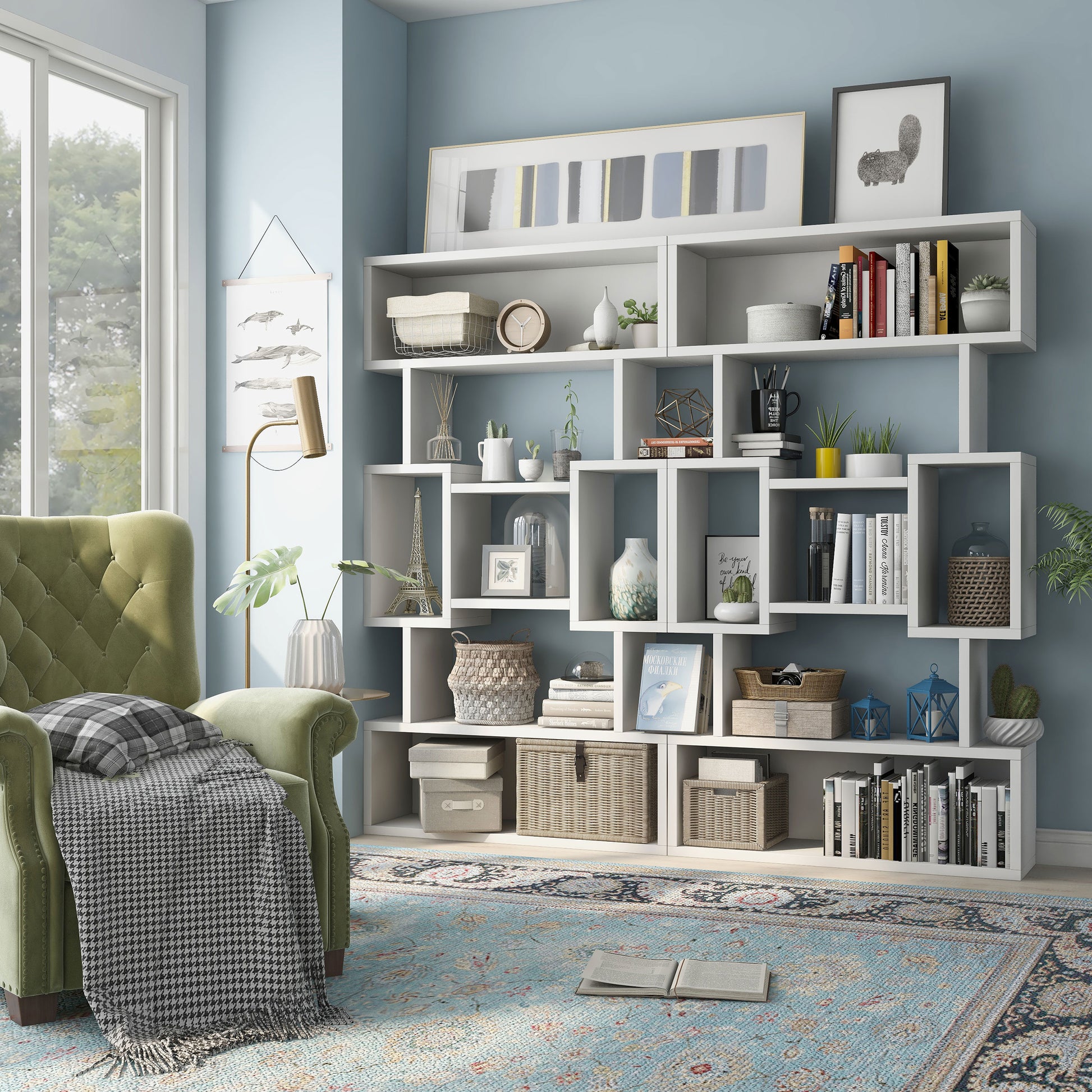 Left angled modern white open cubic bookcase display shelf in a living room with accessories (shown as set of two)