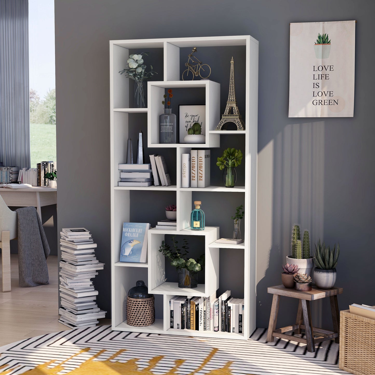 Left angled modern white geometric cube open display bookcase in a living room with accessories