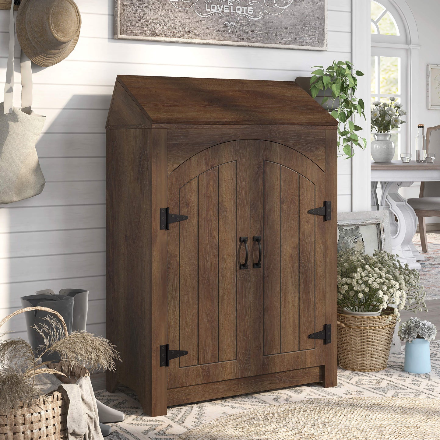 Right angled farmhouse distressed walnut four-shelf shoe cabinet with a lift-top in an entryway with accessories
