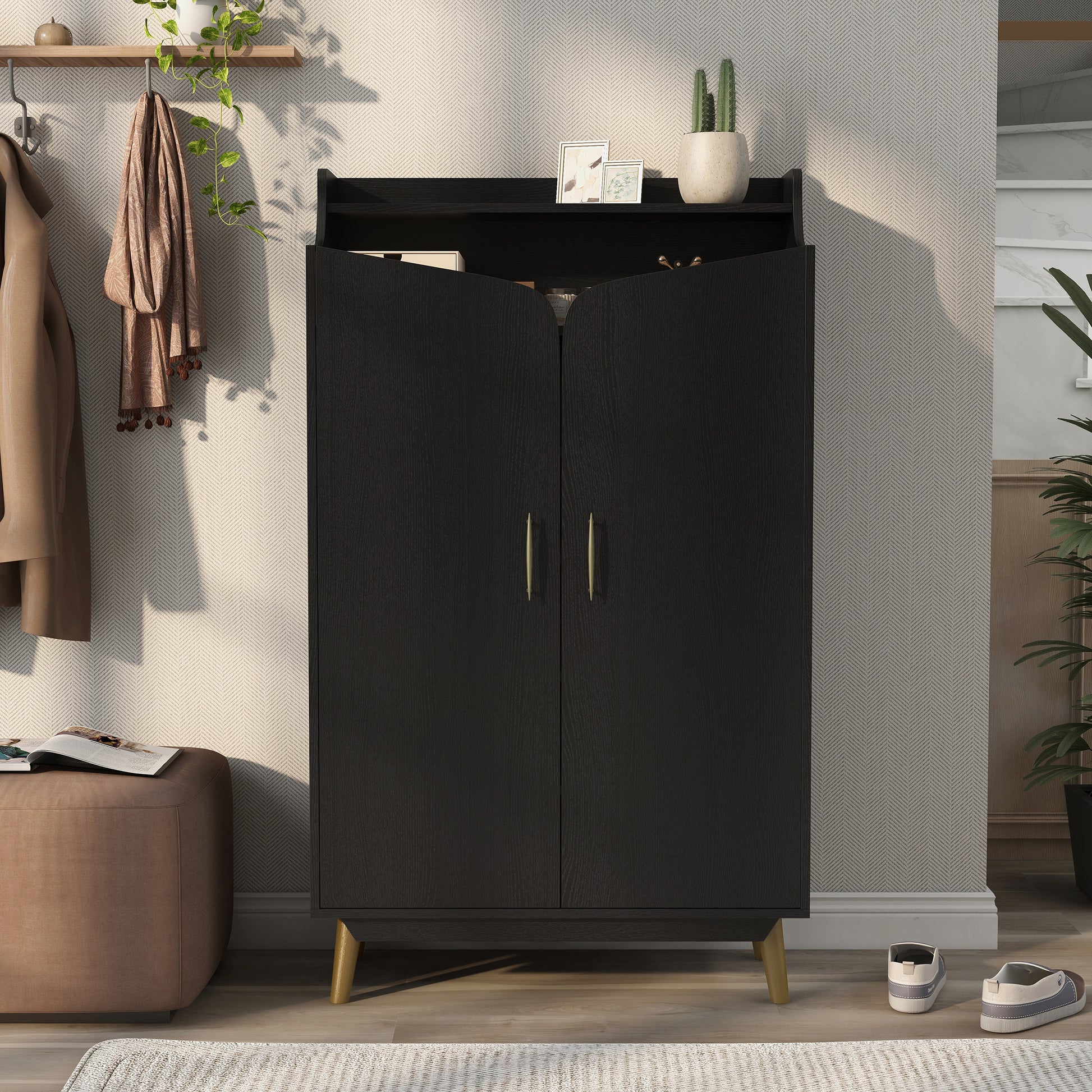 Front-facing transitional black and gold two-door 14-pair shoe cabinet in an entryway with accessories
