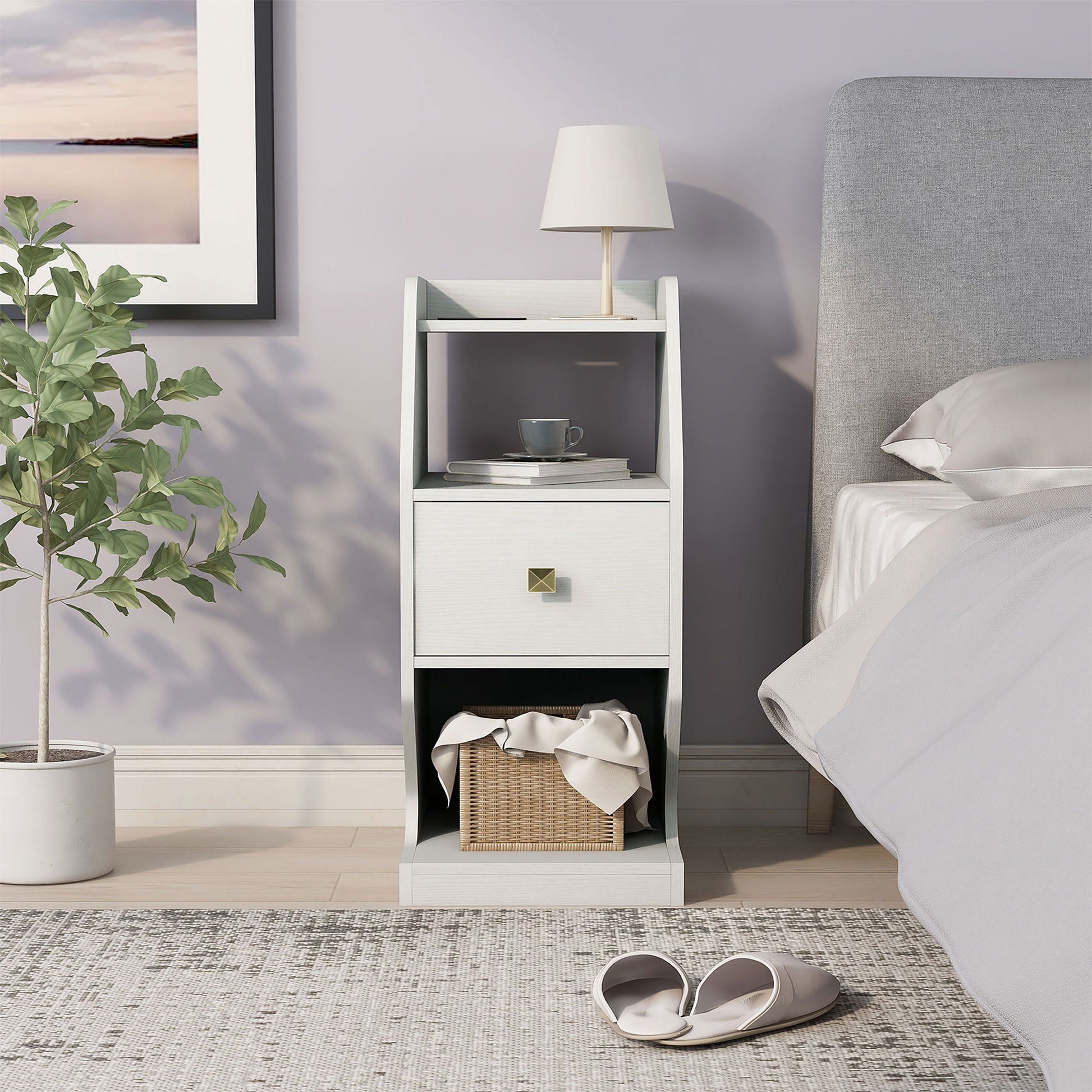 Front-facing transitional white tiered one-drawer nightstand in a bedroom with accessories