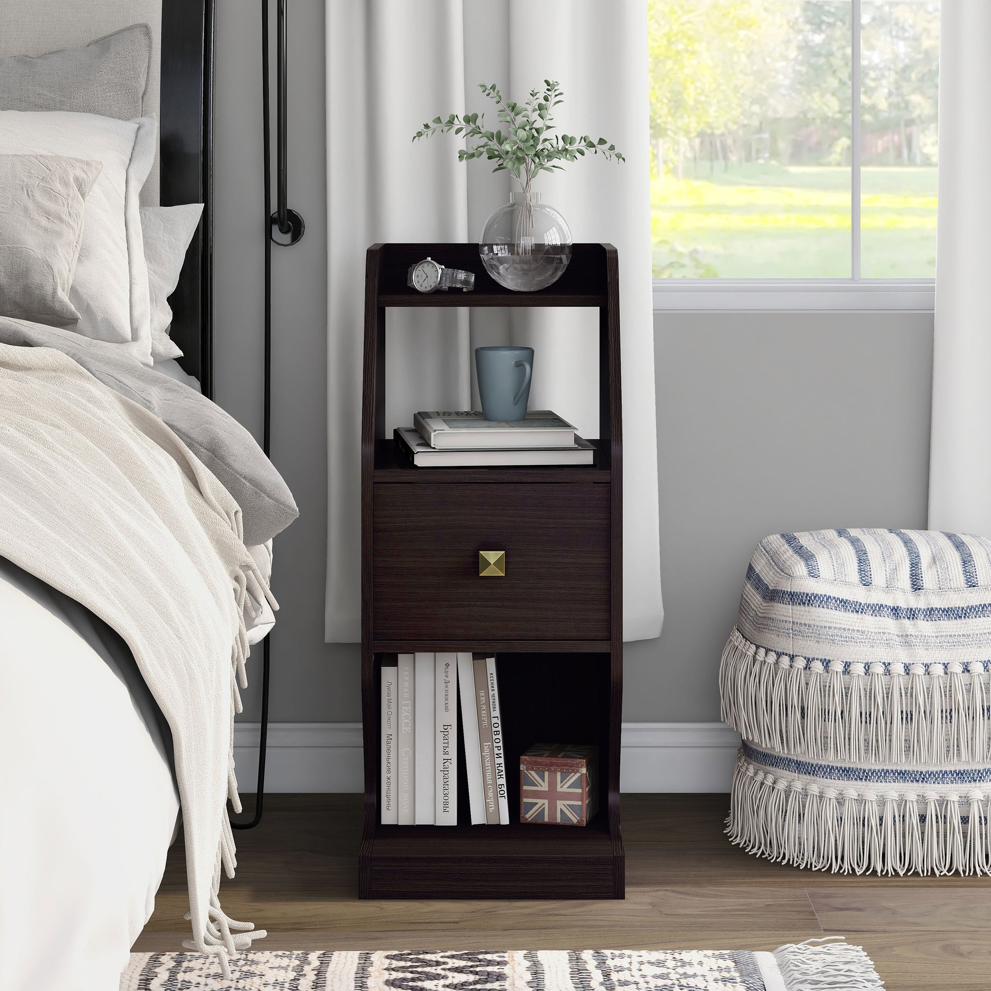 Front-facing transitional espresso tiered one-drawer nightstand in a bedroom with accessories