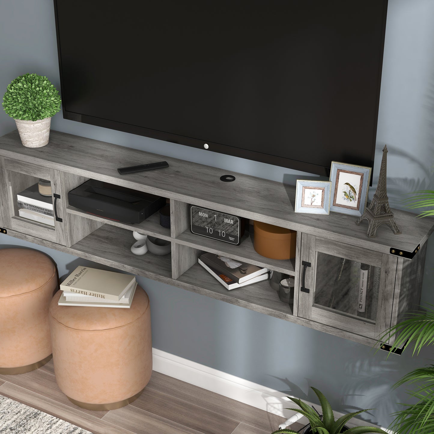 Left angled upper view of a modern vintage gray oak four-shelf wall mountable TV stand with glass doors in a living room with accessories