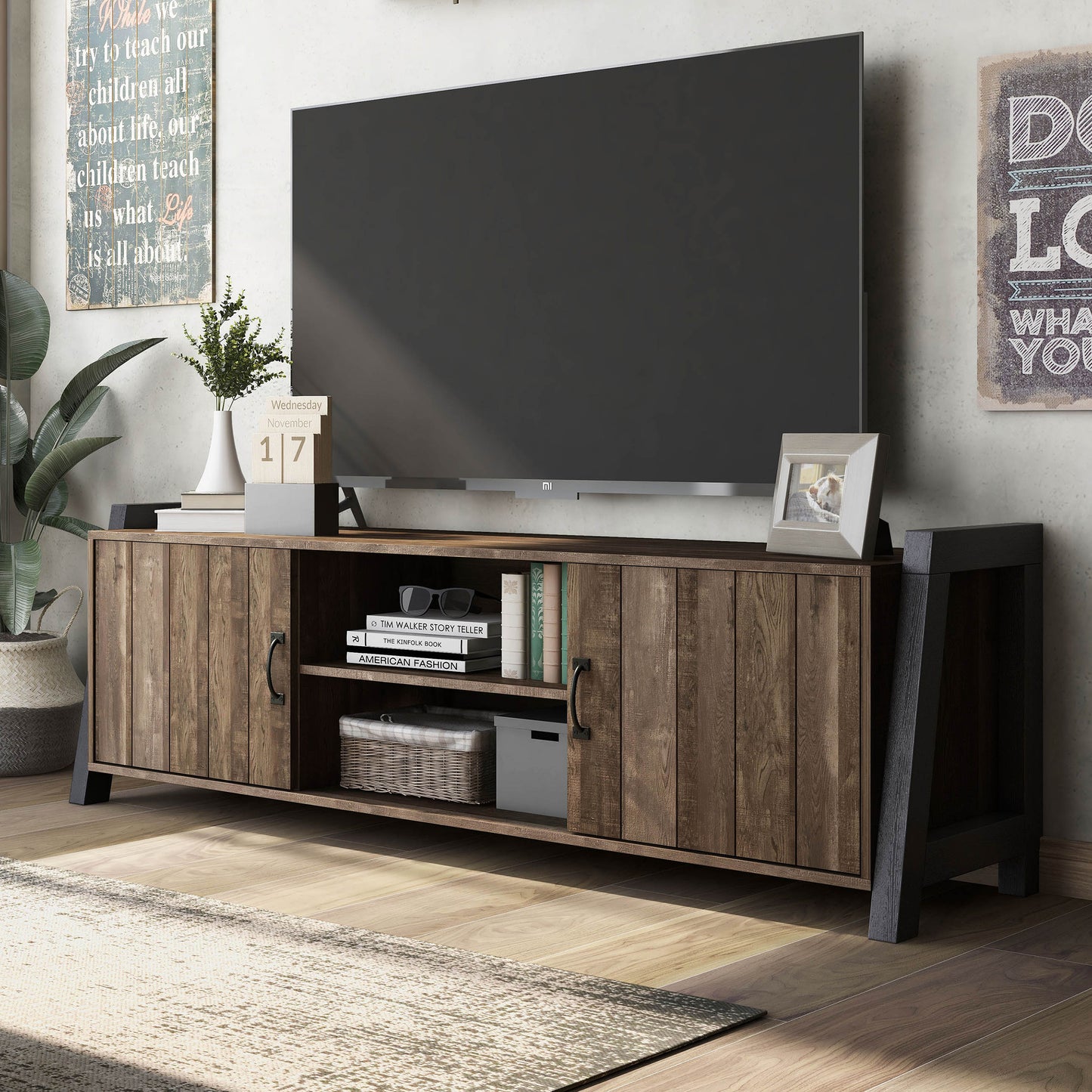 Left angled farmhouse reclaimed oak and black six-shelf TV stand in a living room with accessories
