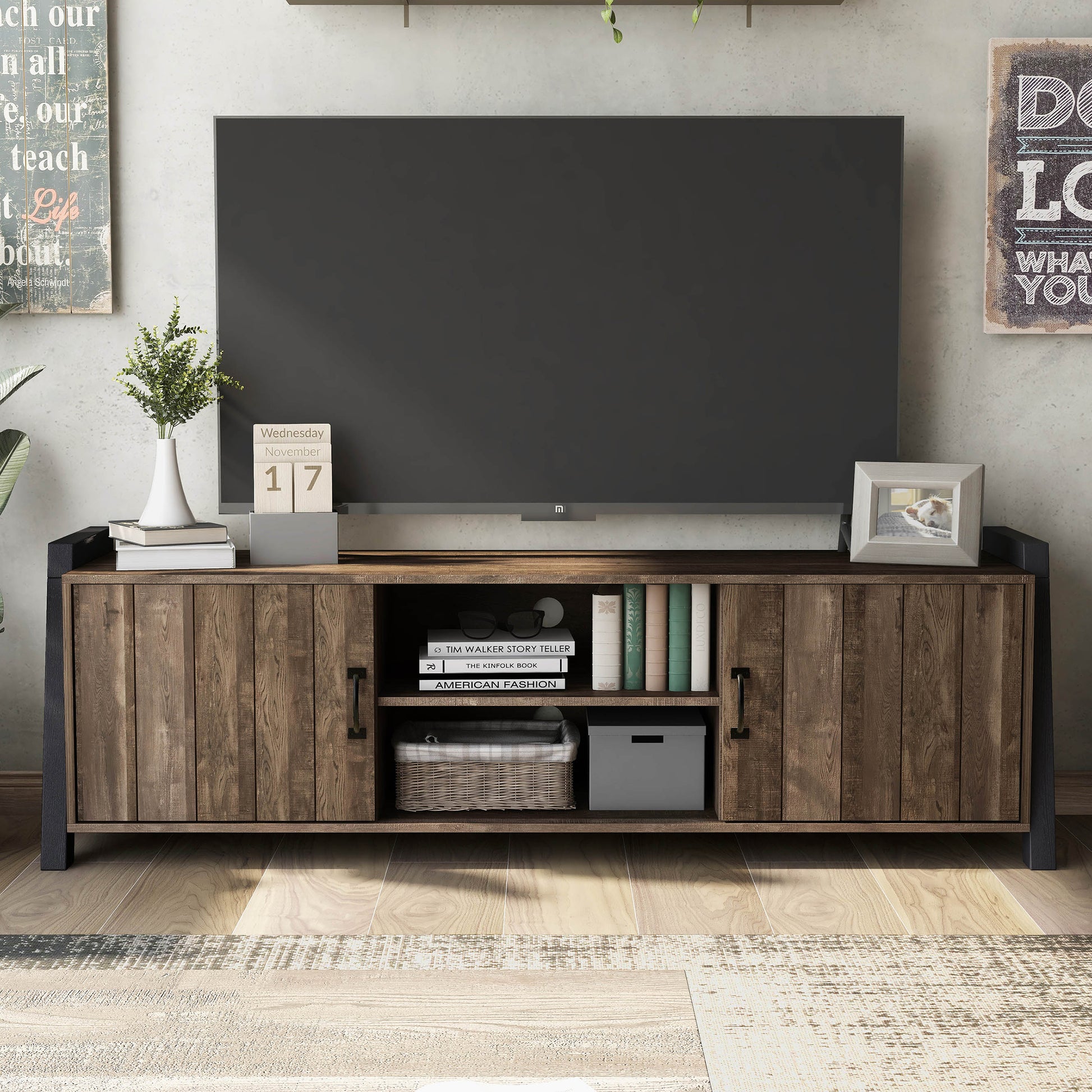 Front-facing farmhouse reclaimed oak and black six-shelf TV stand in a living room with accessories