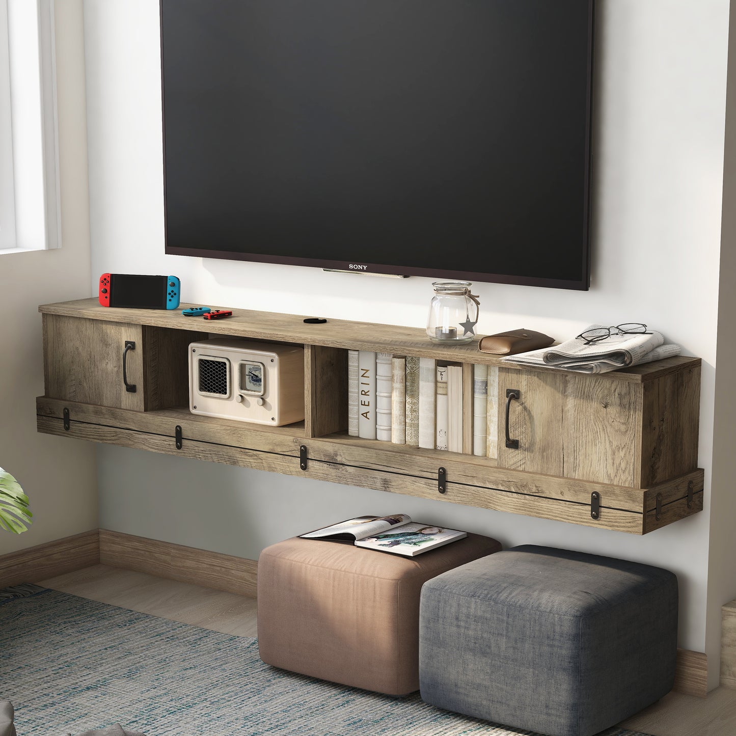 Left angled rustic weathered oak two-door two-shelf floating TV stand in a living room with accessories