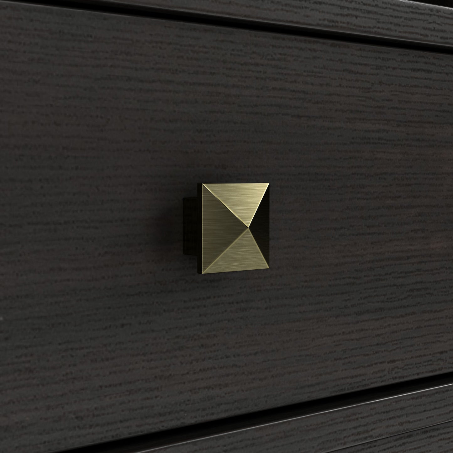 Right angled close-up pyramid door hardware detail view of a transitional espresso two-door tower cabinet