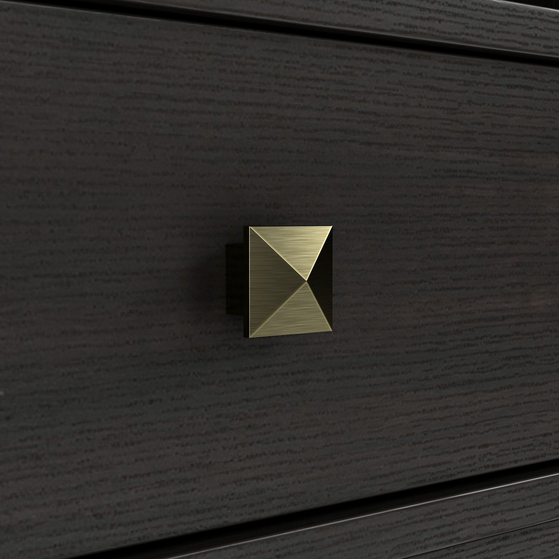 Right angled close-up pyramid door hardware detail view of a transitional espresso two-door tower cabinet