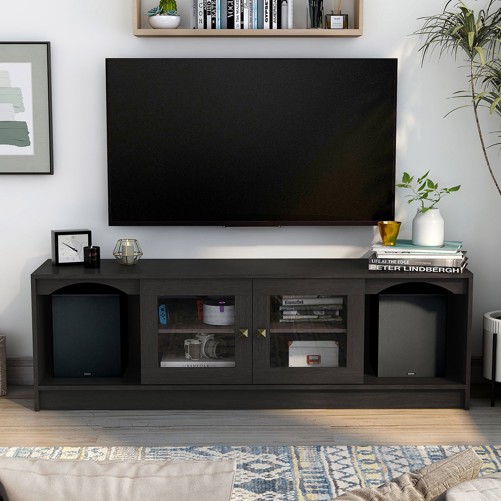 Front-facing transitional espresso two-sliding door TV stand in a living room with accessories