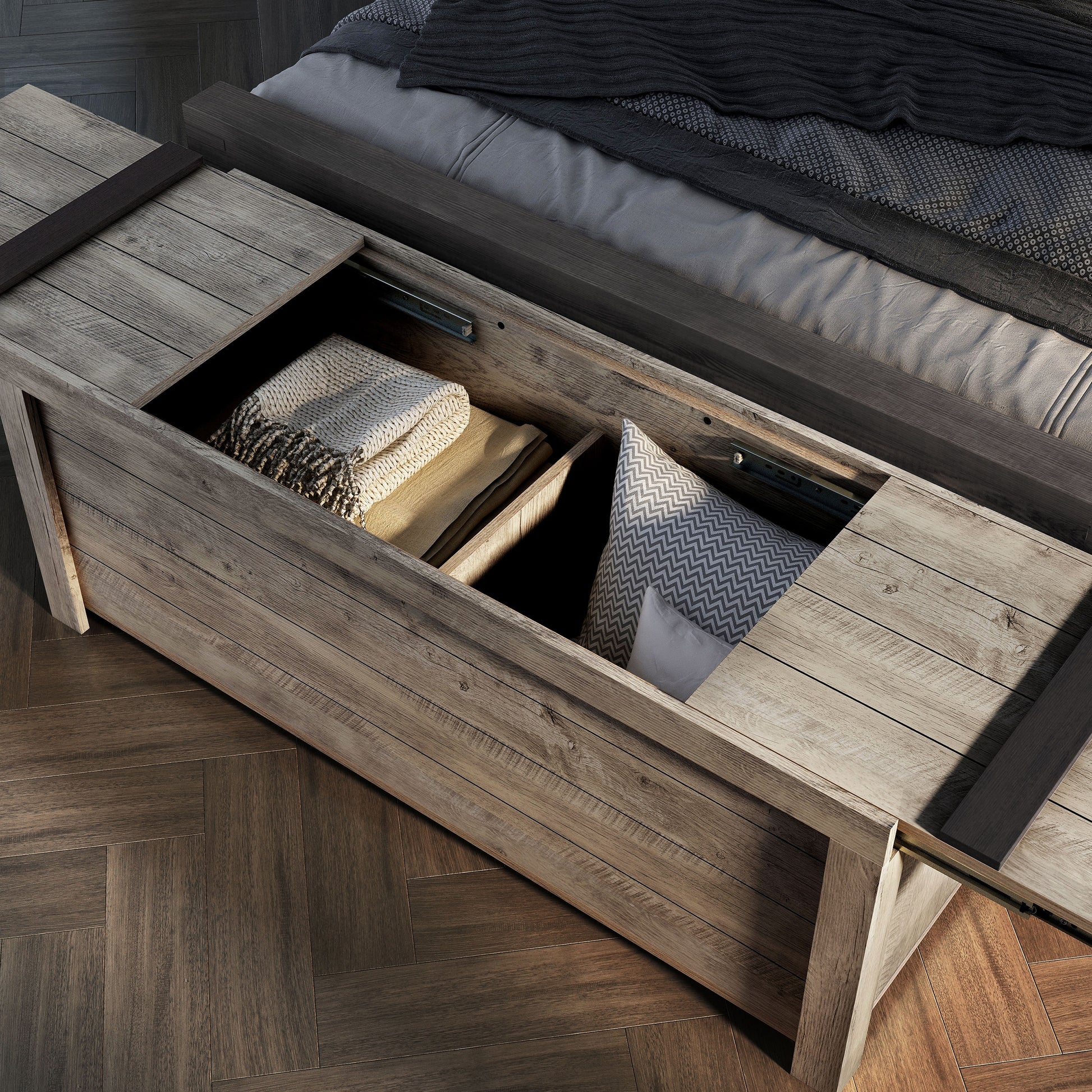 Right angled bird's eye view of a farmhouse weathered oak sliding top storage bench with top open in a bedroom with accessories