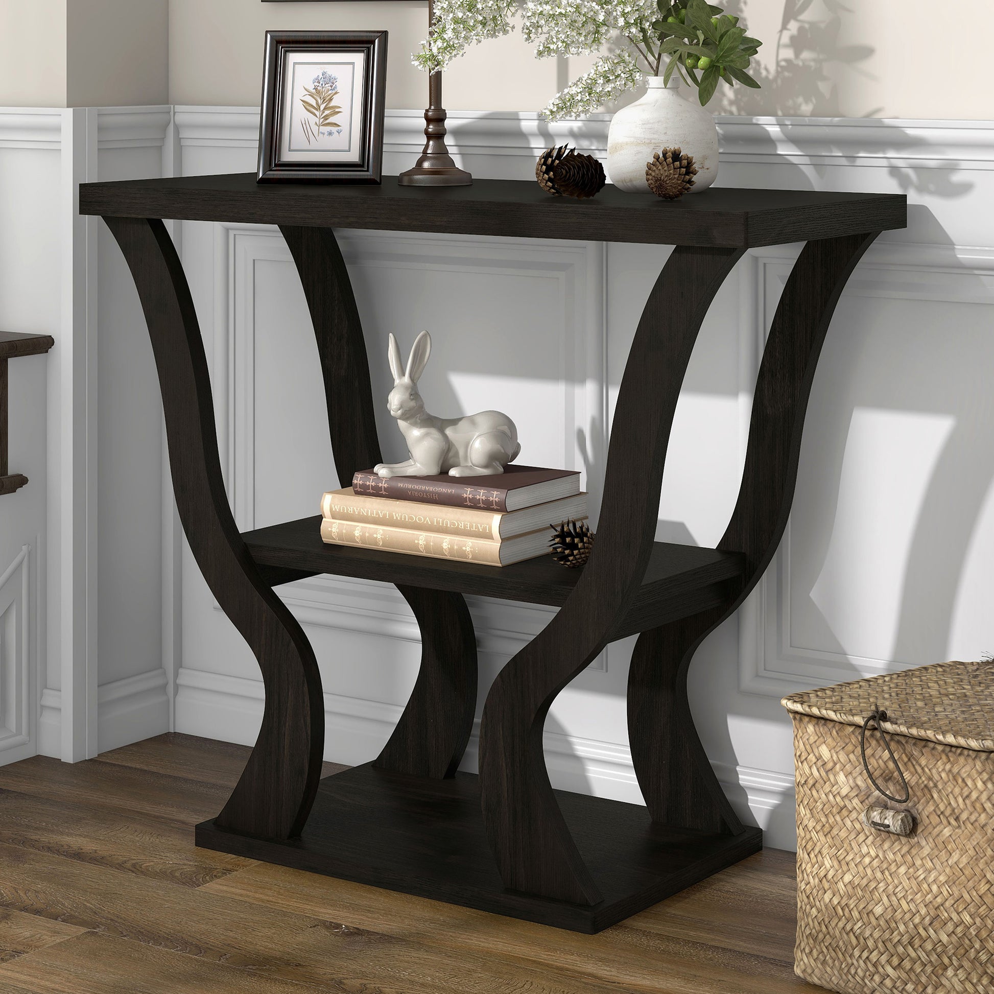 Left angled transitional espresso curvy console table in a living area with accessories