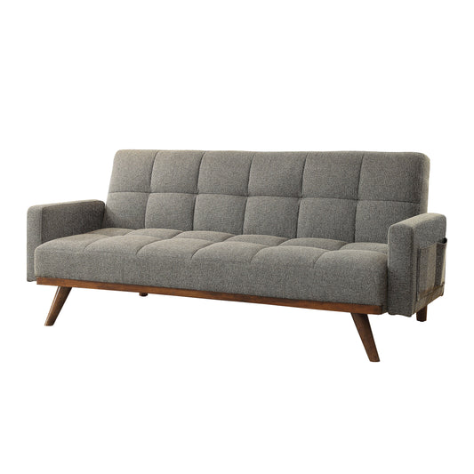 Left angled mid-century modern gray tufted futon with a wood base on a white background