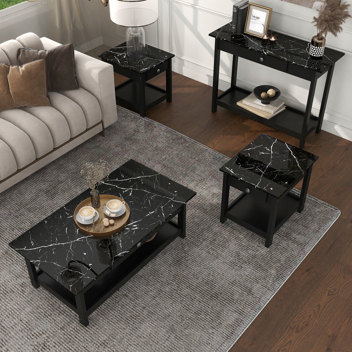 Right angled bird's eye view of a four-piece modern black and faux marble coffee table set with lower shelves in a living area with accessories
