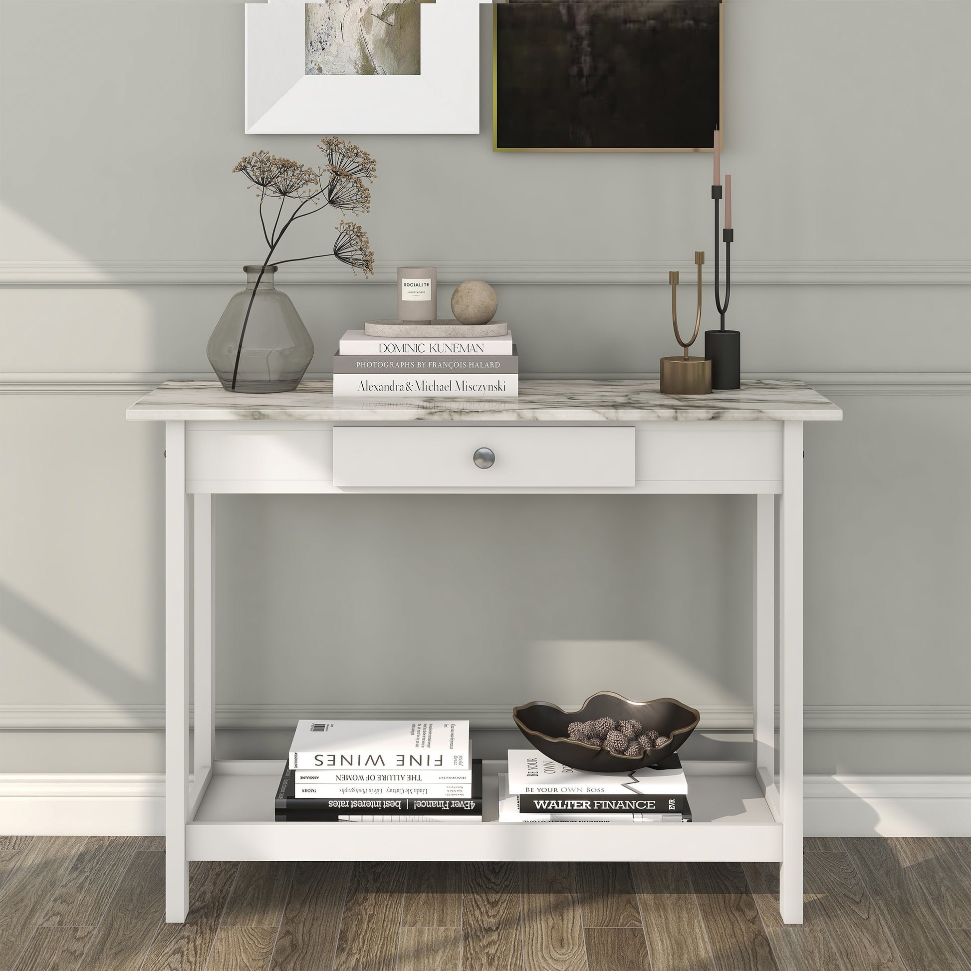 Front-facing modern white and faux marble console table with a lower shelf in a living area with accessories