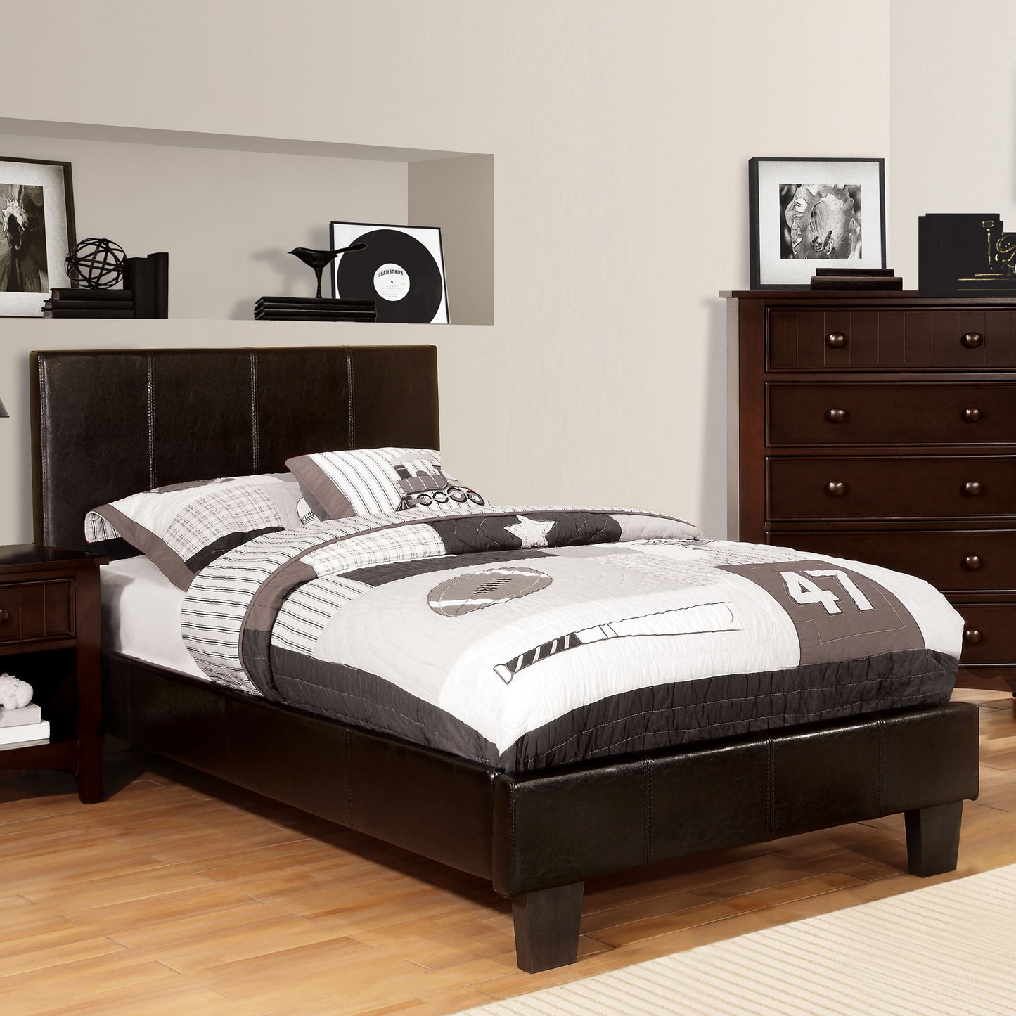 Right angled contemporary espresso faux leather twin platform bed in a bedroom with accessories