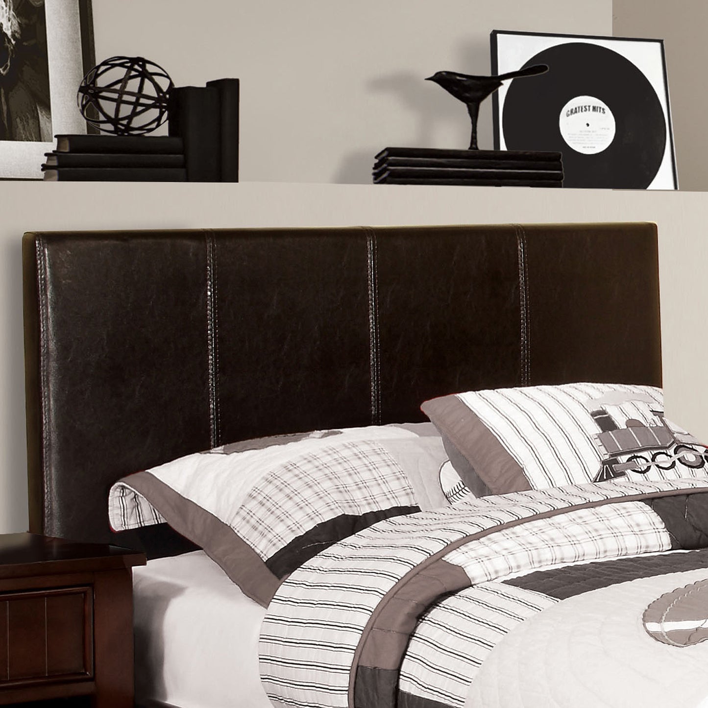 Right angled headboard detail on a contemporary espresso faux leather twin platform bed in a bedroom with accessories