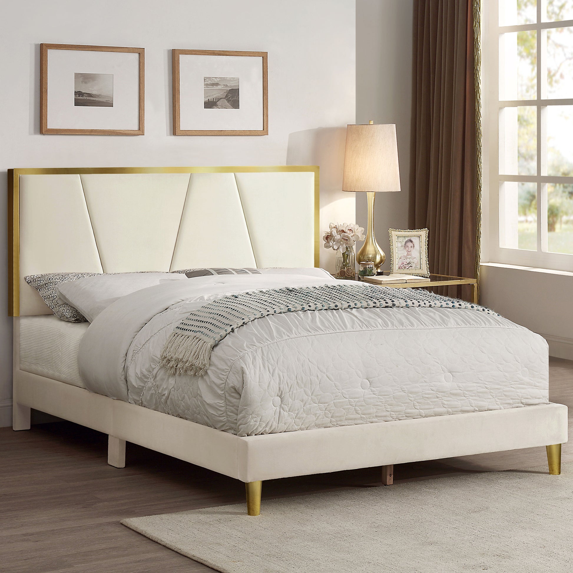 Right angled contemporary beige and gold upholstered full bed in a bedroom with accessories