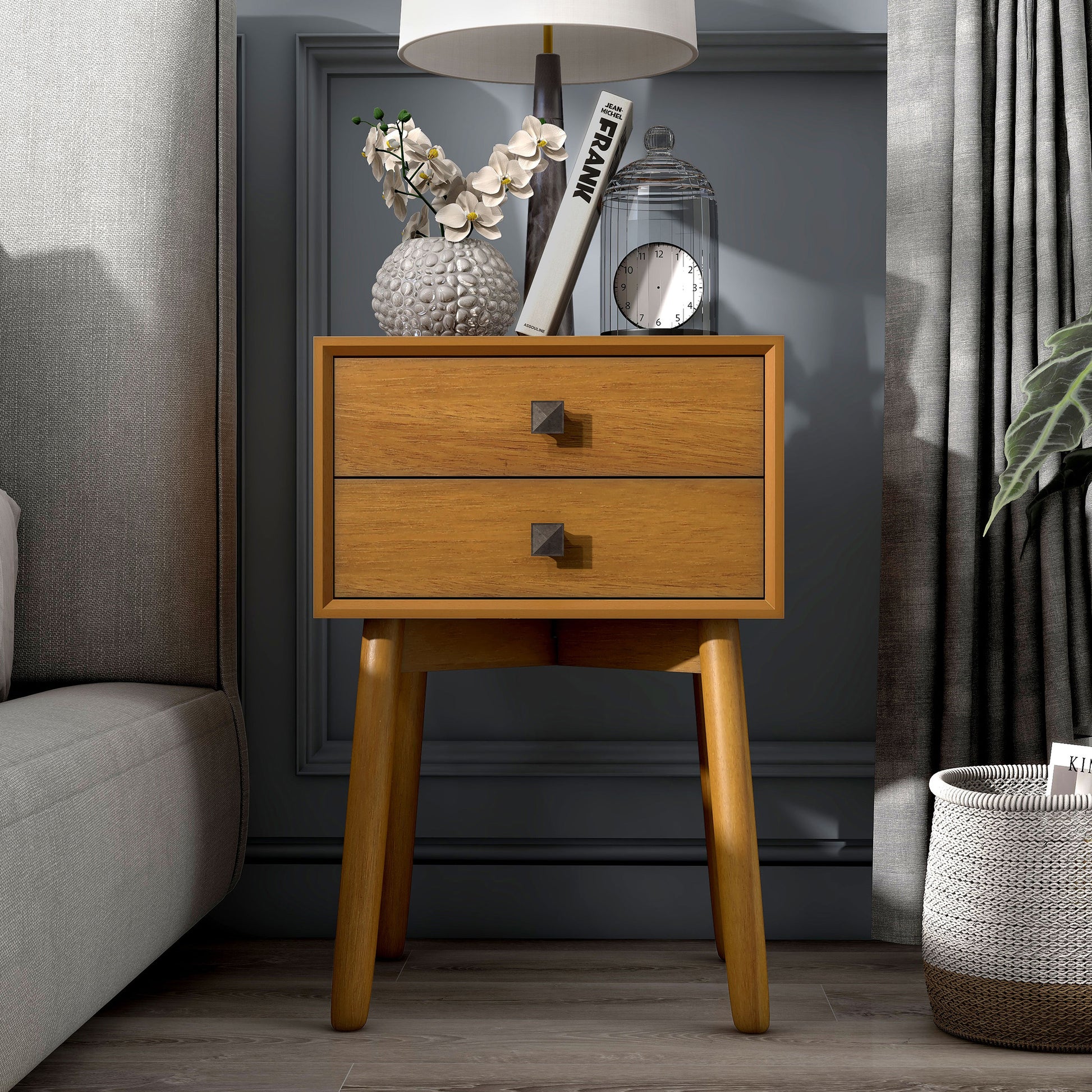 Front-facing modern light oak two-drawer compact nightstand with splayed legs in a bedroom with accessories