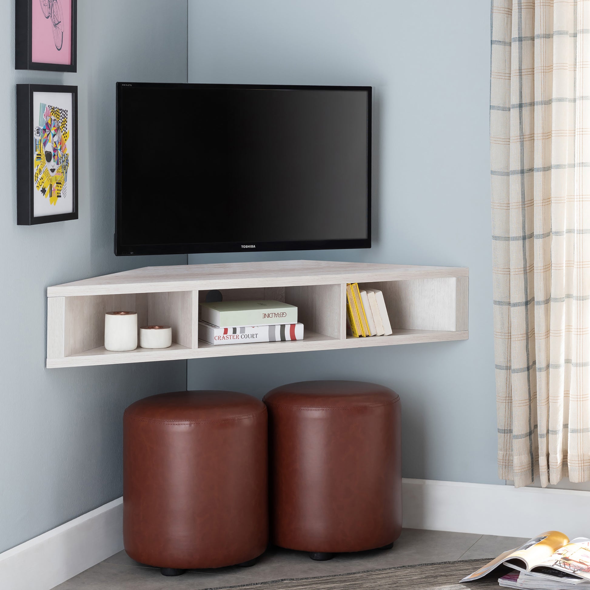 Right angled modern white oak corner three-shelf floating TV stand in a living area with accessories