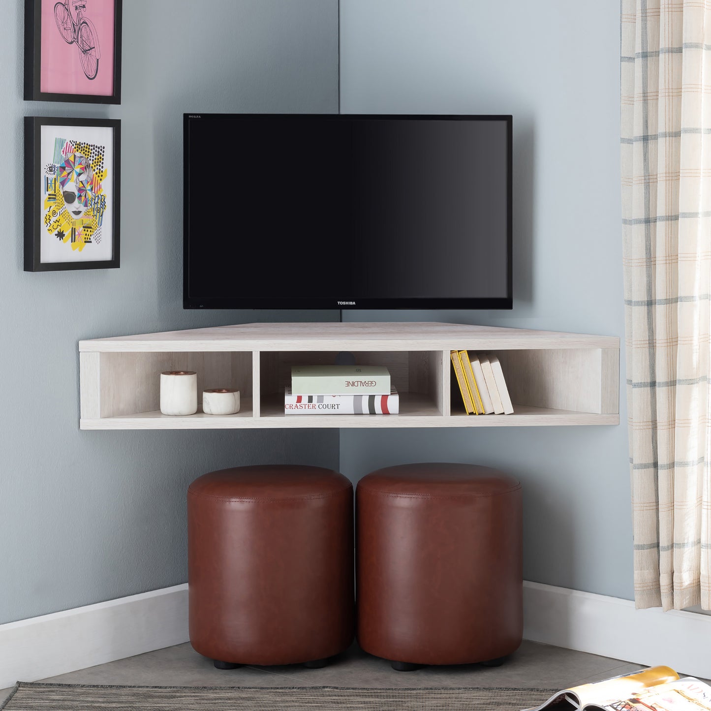 Front-facing modern white oak corner three-shelf floating TV stand in a living area with accessories