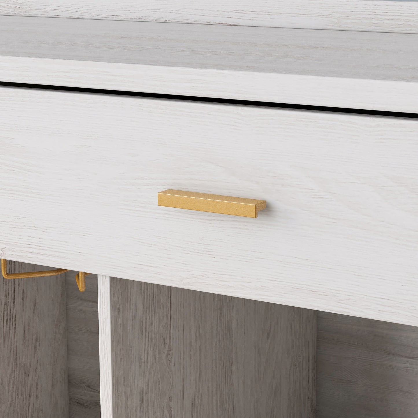 Left angled gold drawer pull close-up of a modern farmhouse white oak five-shelf two-drawer buffet with wine storage