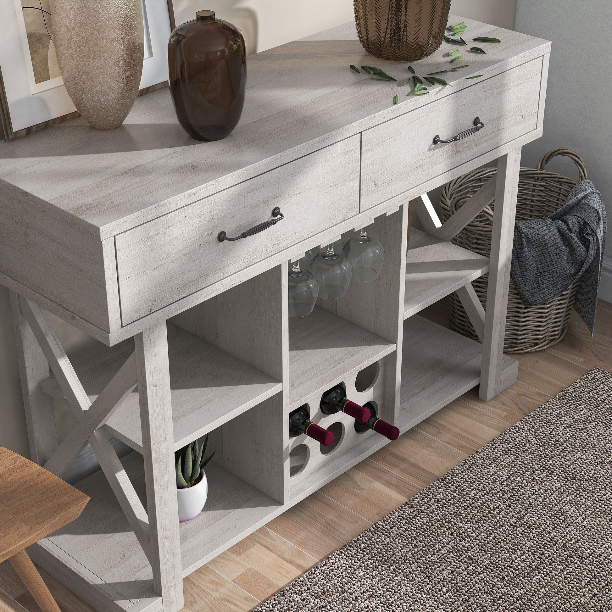 Right angled bird's eye view of a modern farmhouse white oak two-drawer four-shelf wine bar with bottle and stemware racks in a living area with accessories