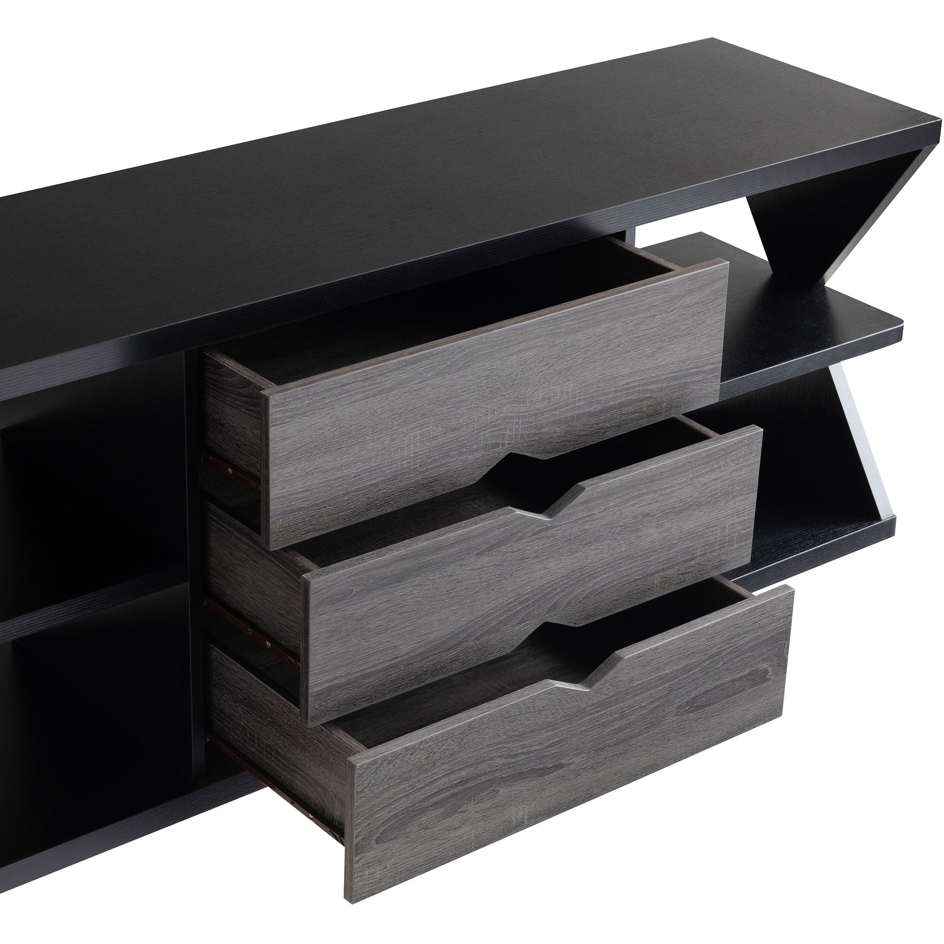Right angled bird's eye view modern black and distressed gray three-drawer TV stand with drawers open on a white background
